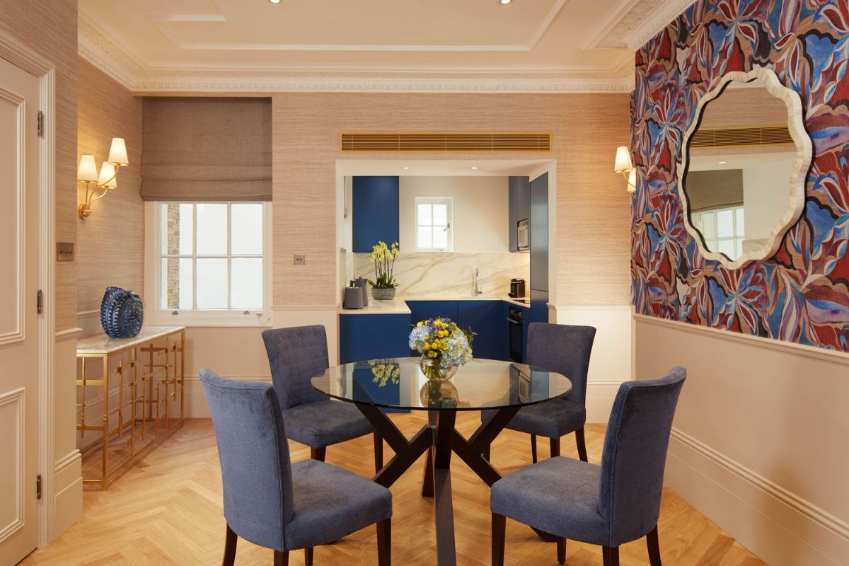 a dining room with a table and chairs