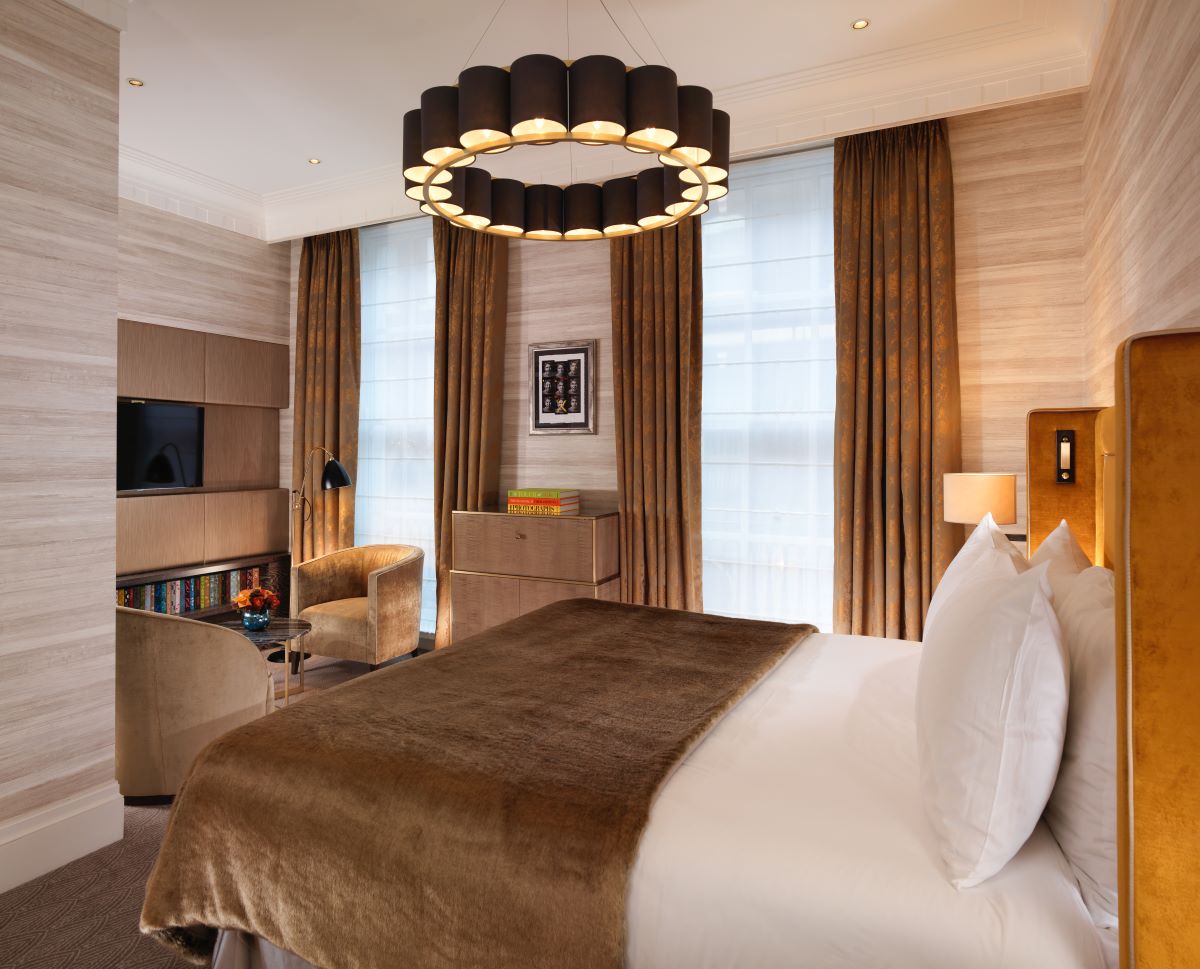 a room with a bed and a television