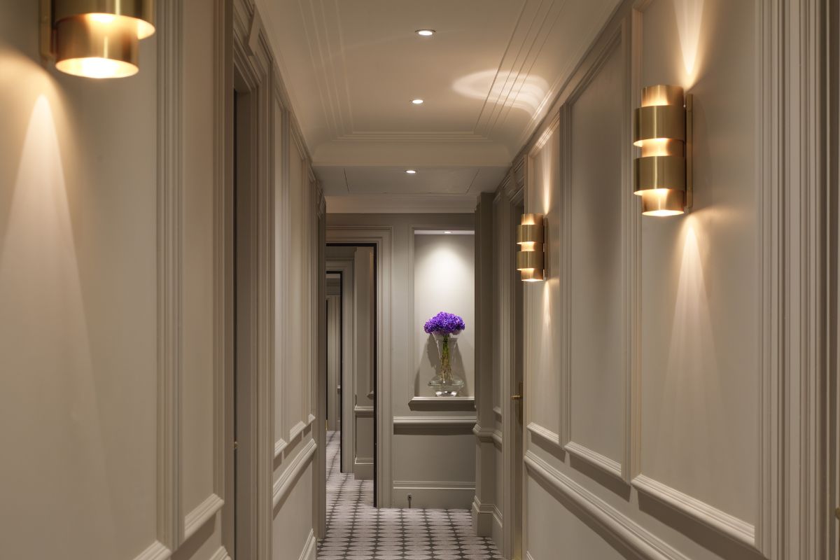 a hallway with a vase of flowers