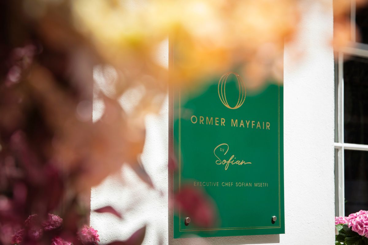 a green sign on a wall