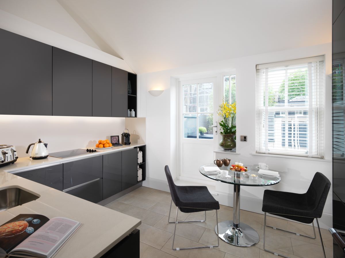 a kitchen with a table and chairs