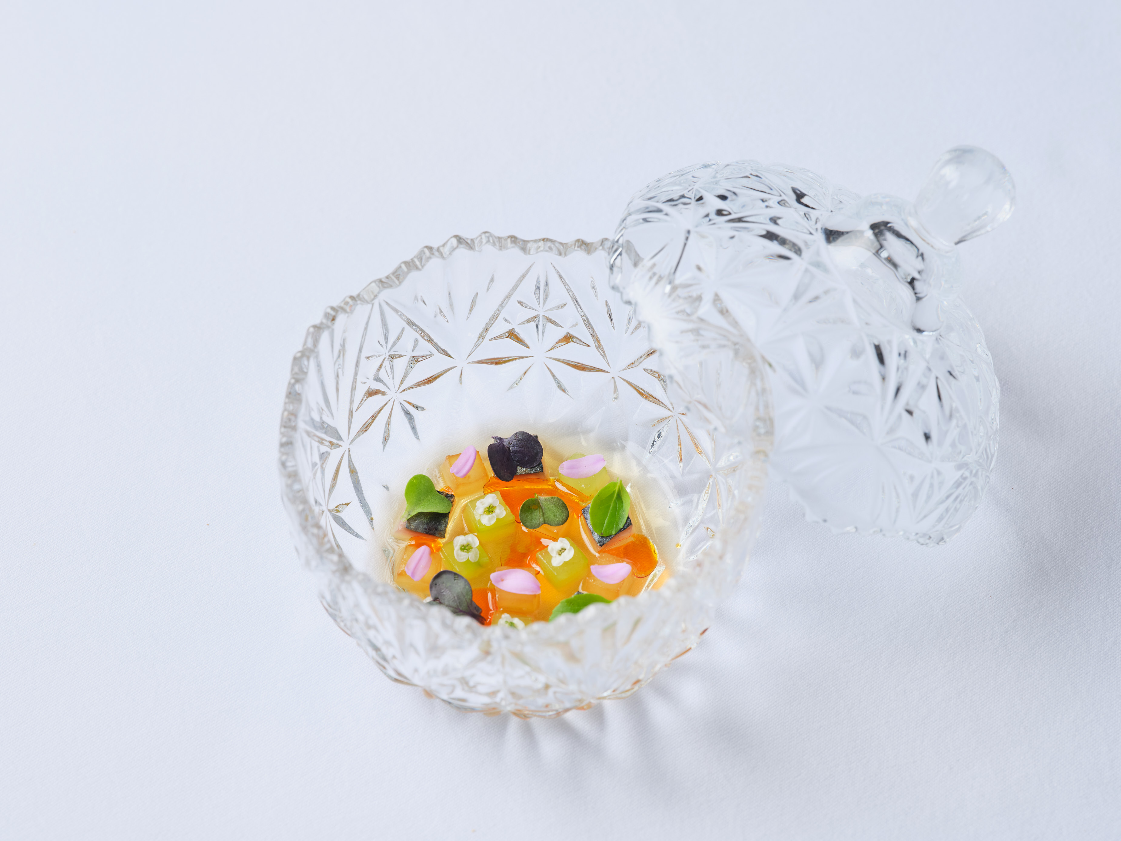 a glass bowl with a lid