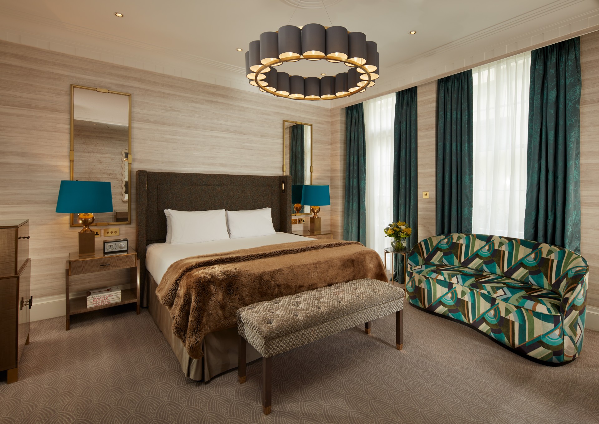 a bedroom with a bed and a couch