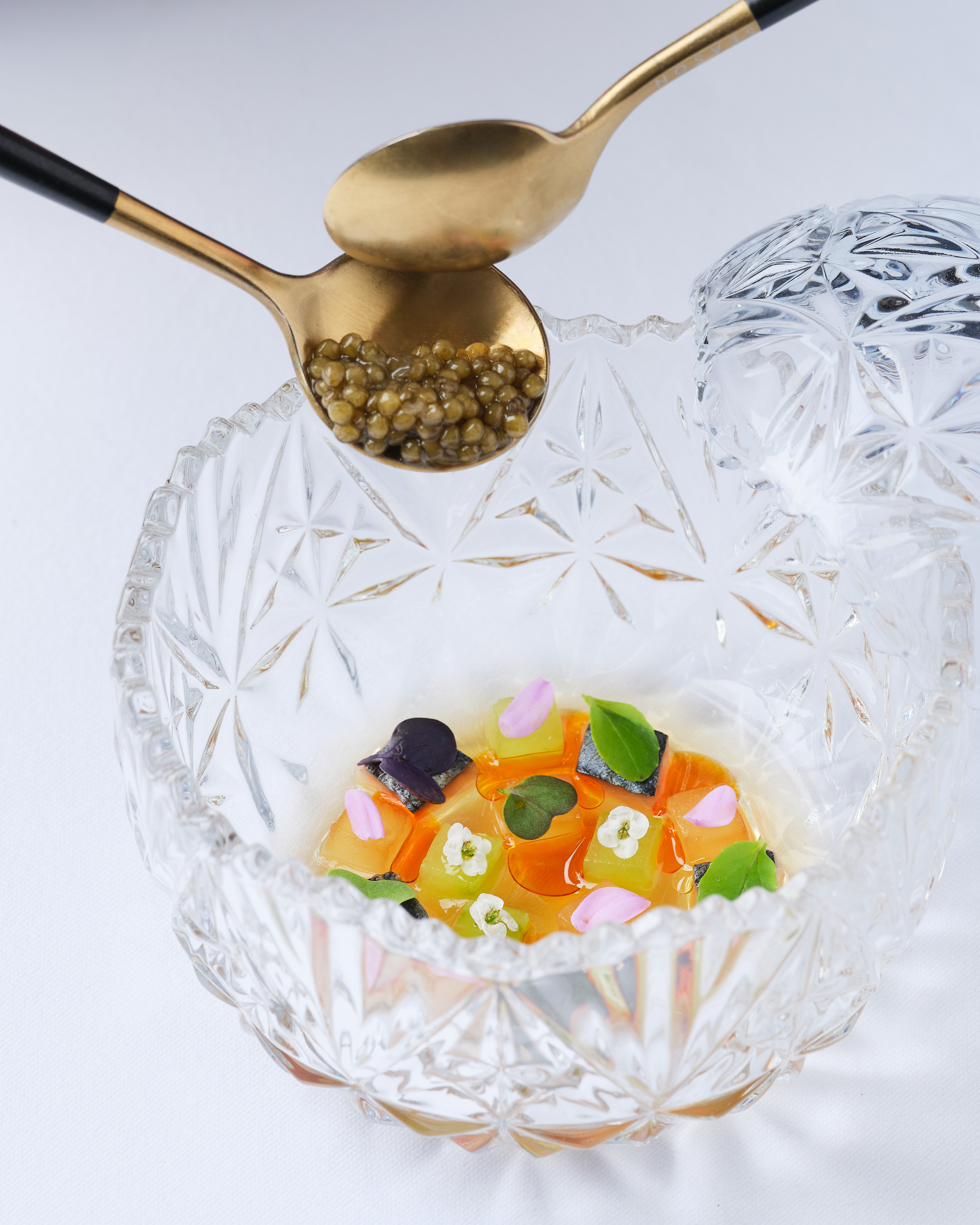 a spoon over a bowl of food