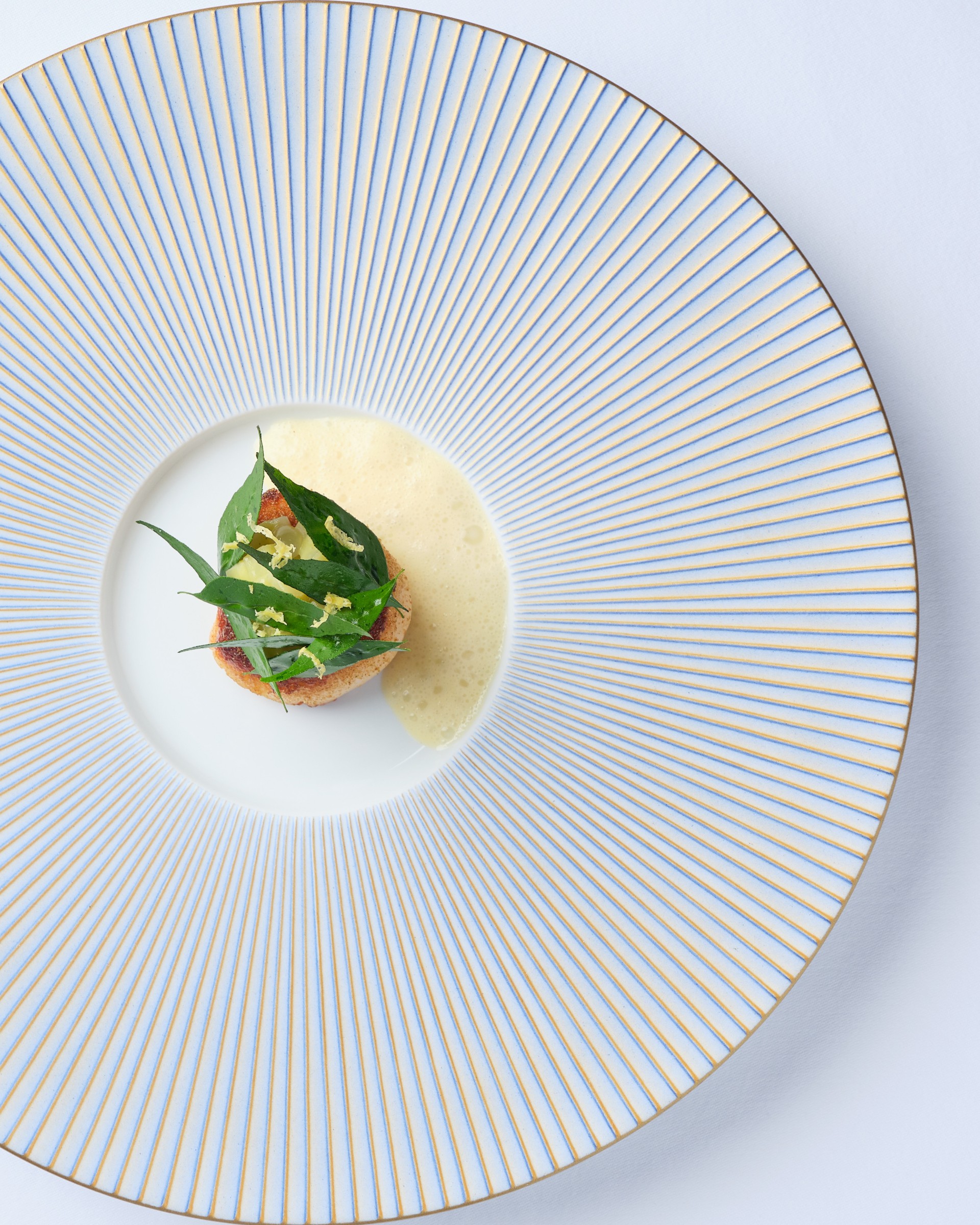 a plate of food on a white surface