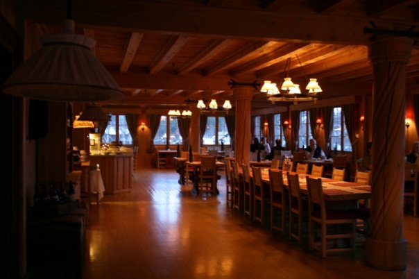 a restaurant with many tables and chairs
