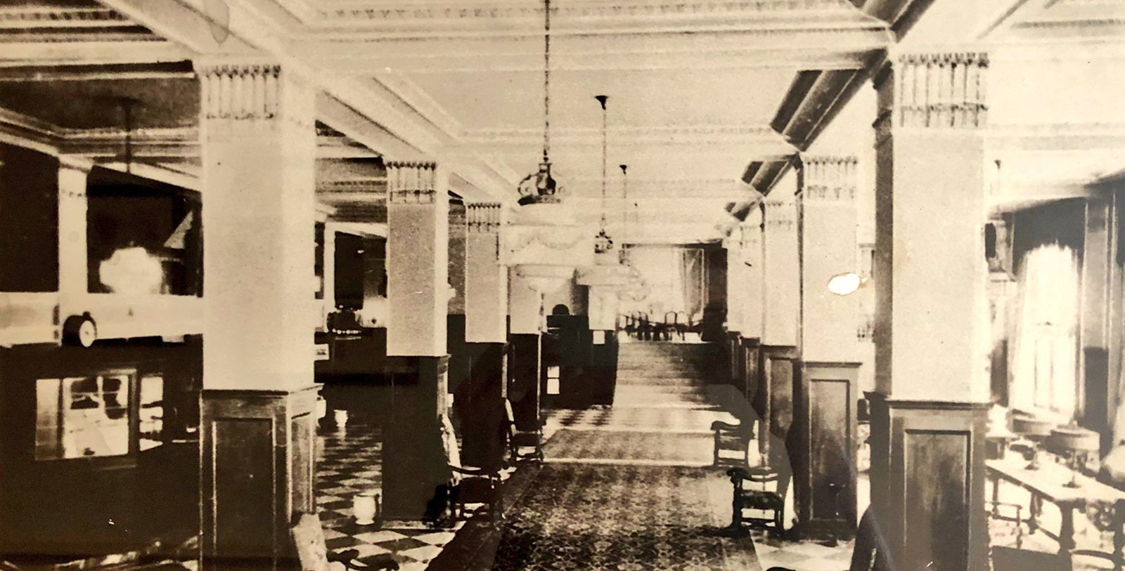a black and white photo of a hallway