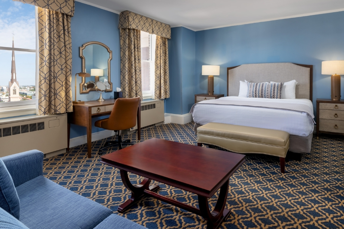 a room with a bed and a desk