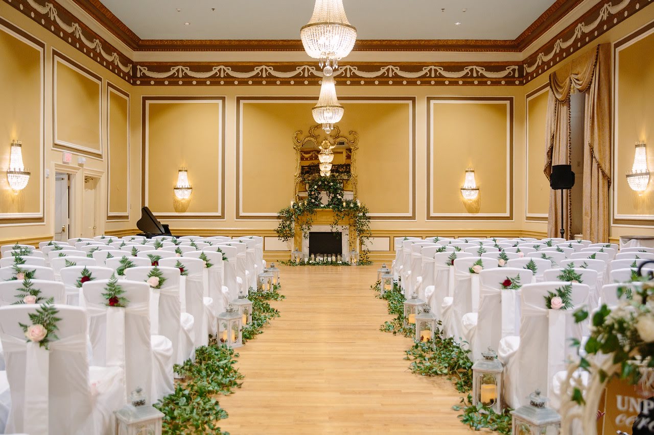 a room with chairs and a fireplace