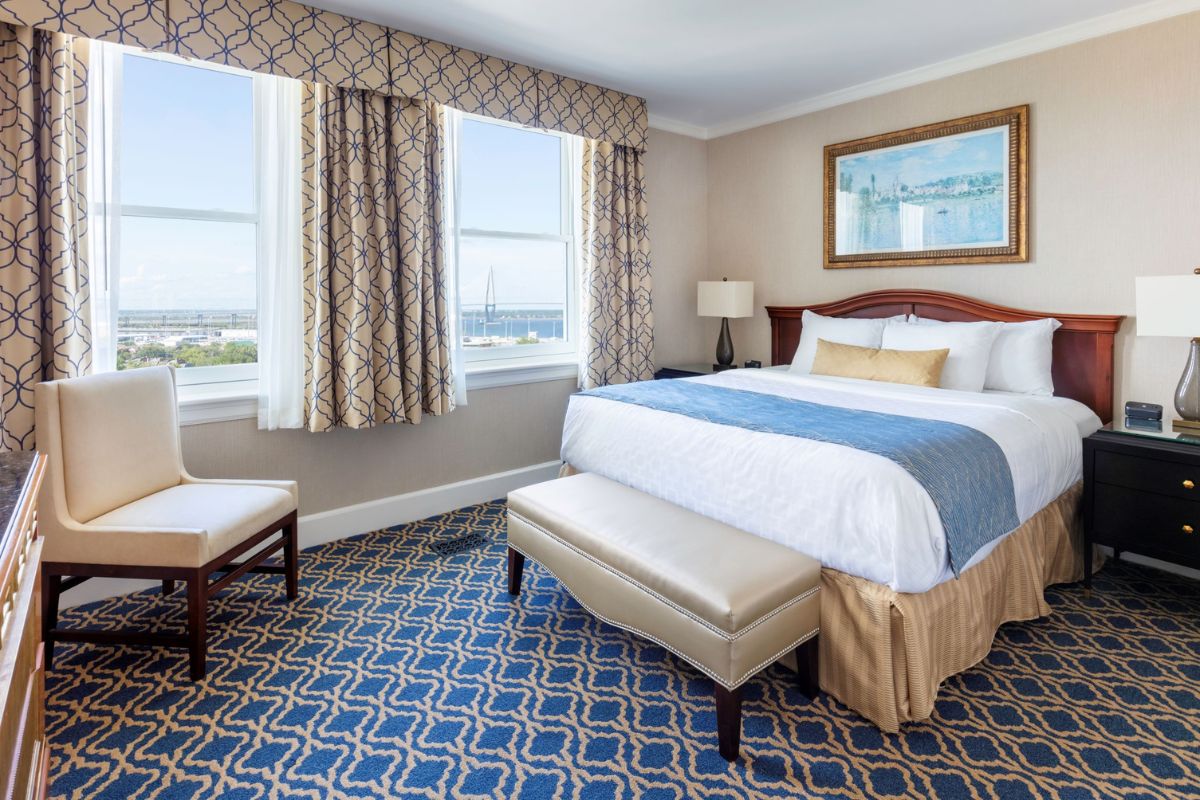 a bedroom with a bed and a chair