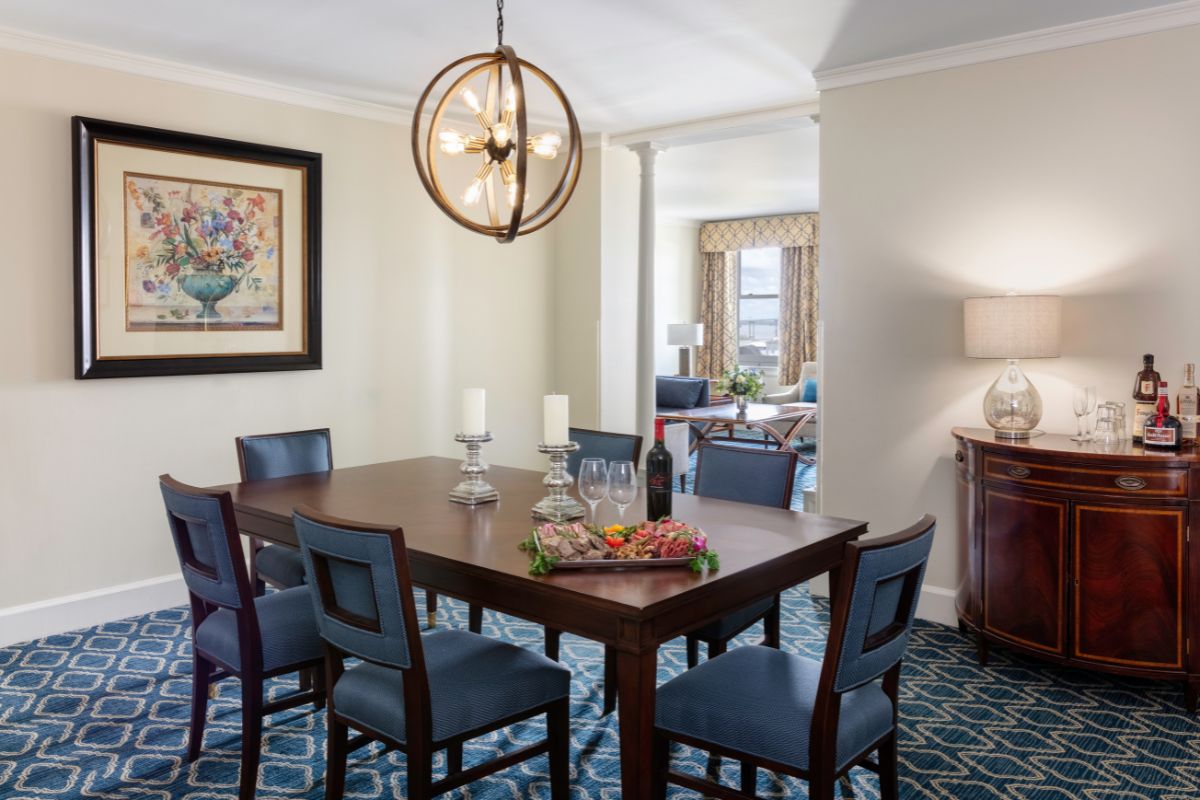 a dining room with a table and chairs