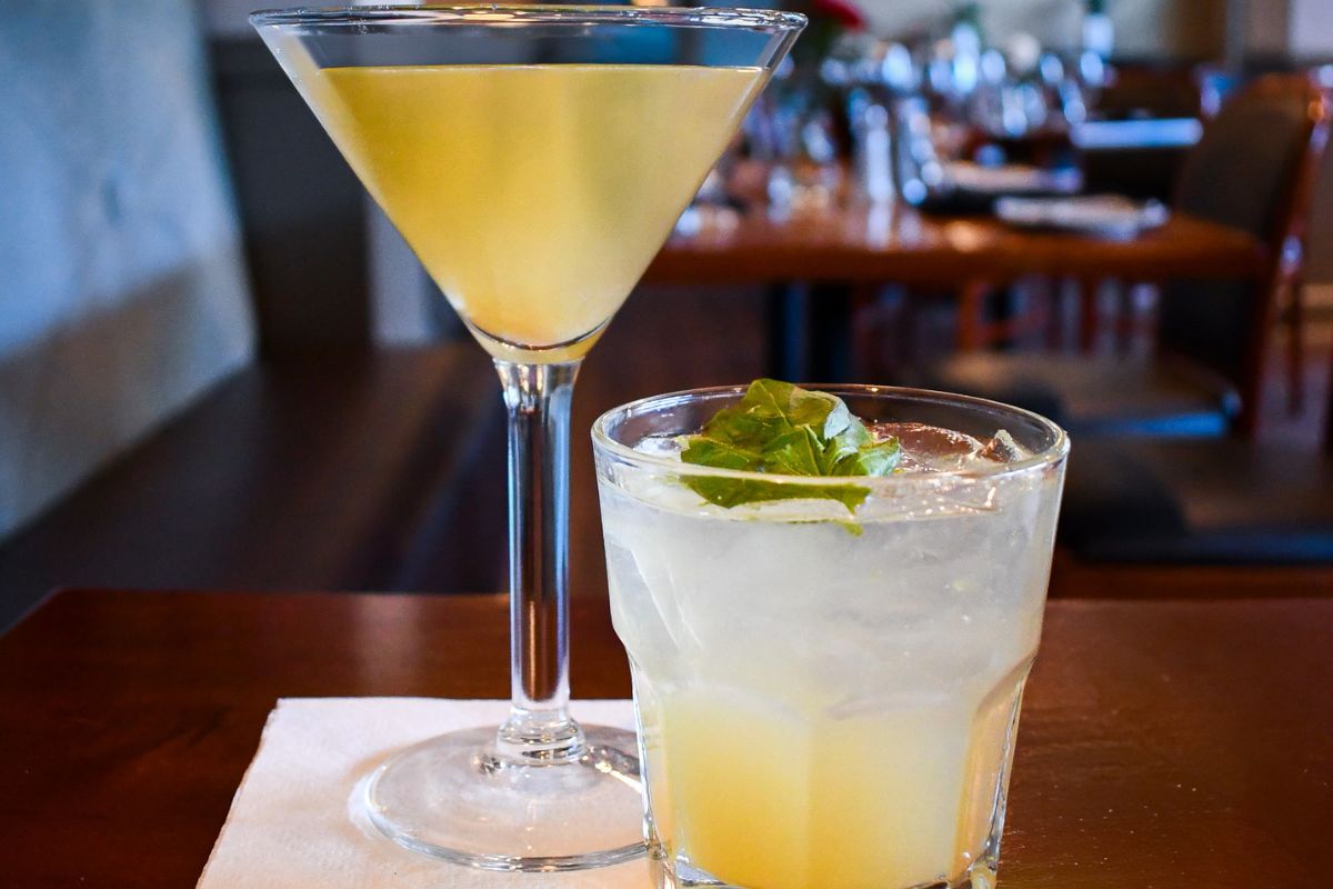 a glass of liquid next to a glass of liquid