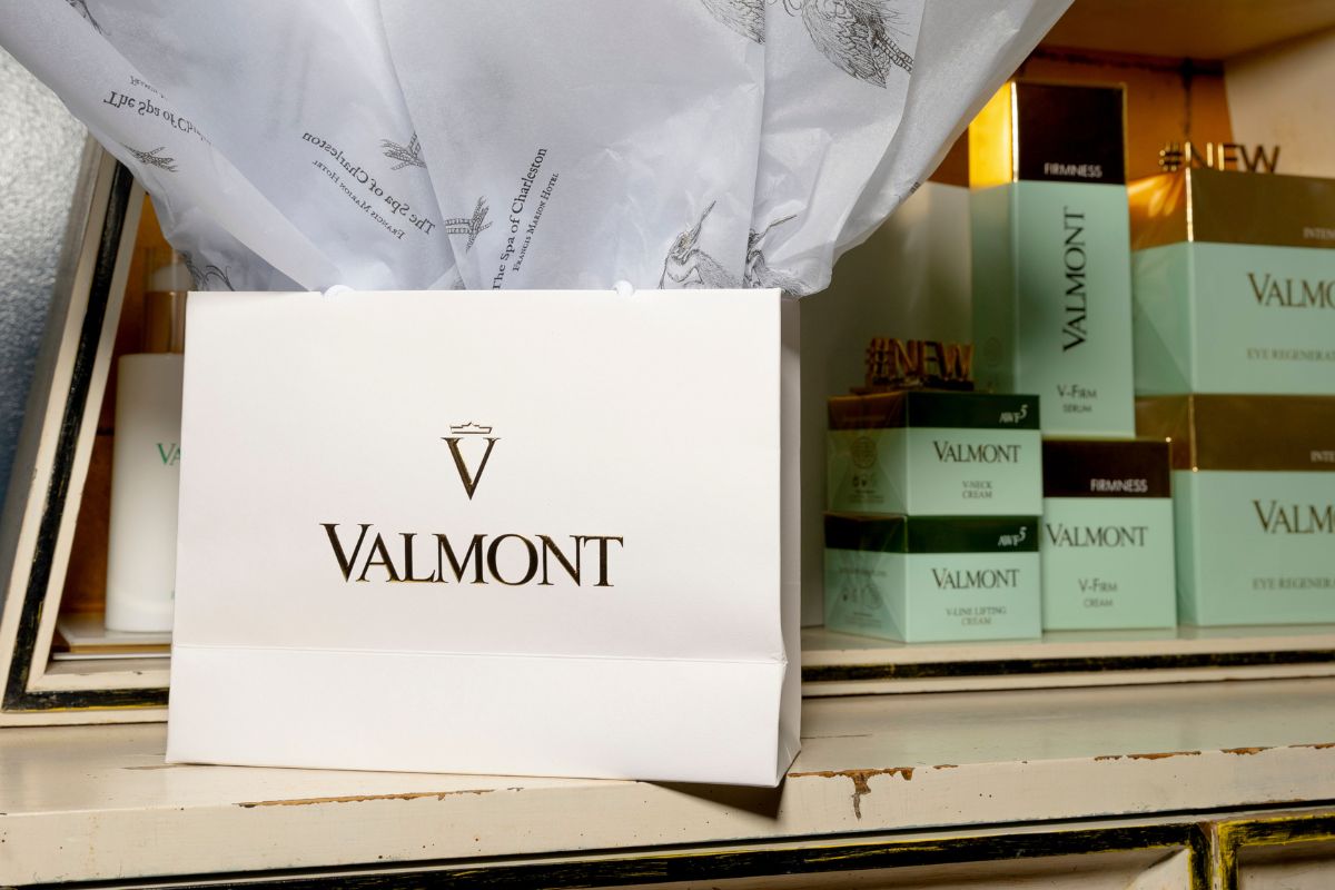 a white bag with black text on it next to several boxes
