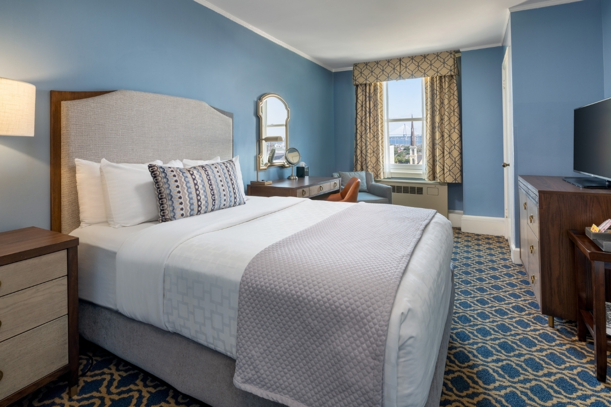 a room with a bed and a window