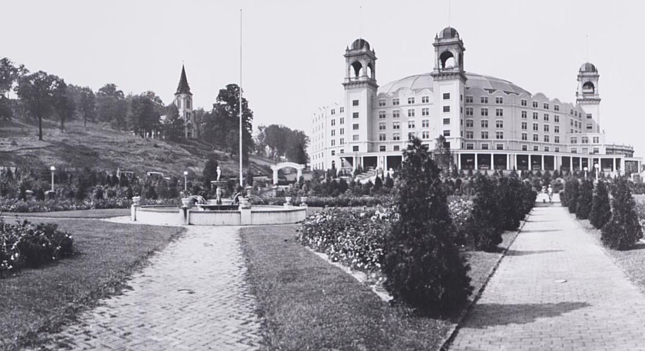 a large building with a fountain in front of it