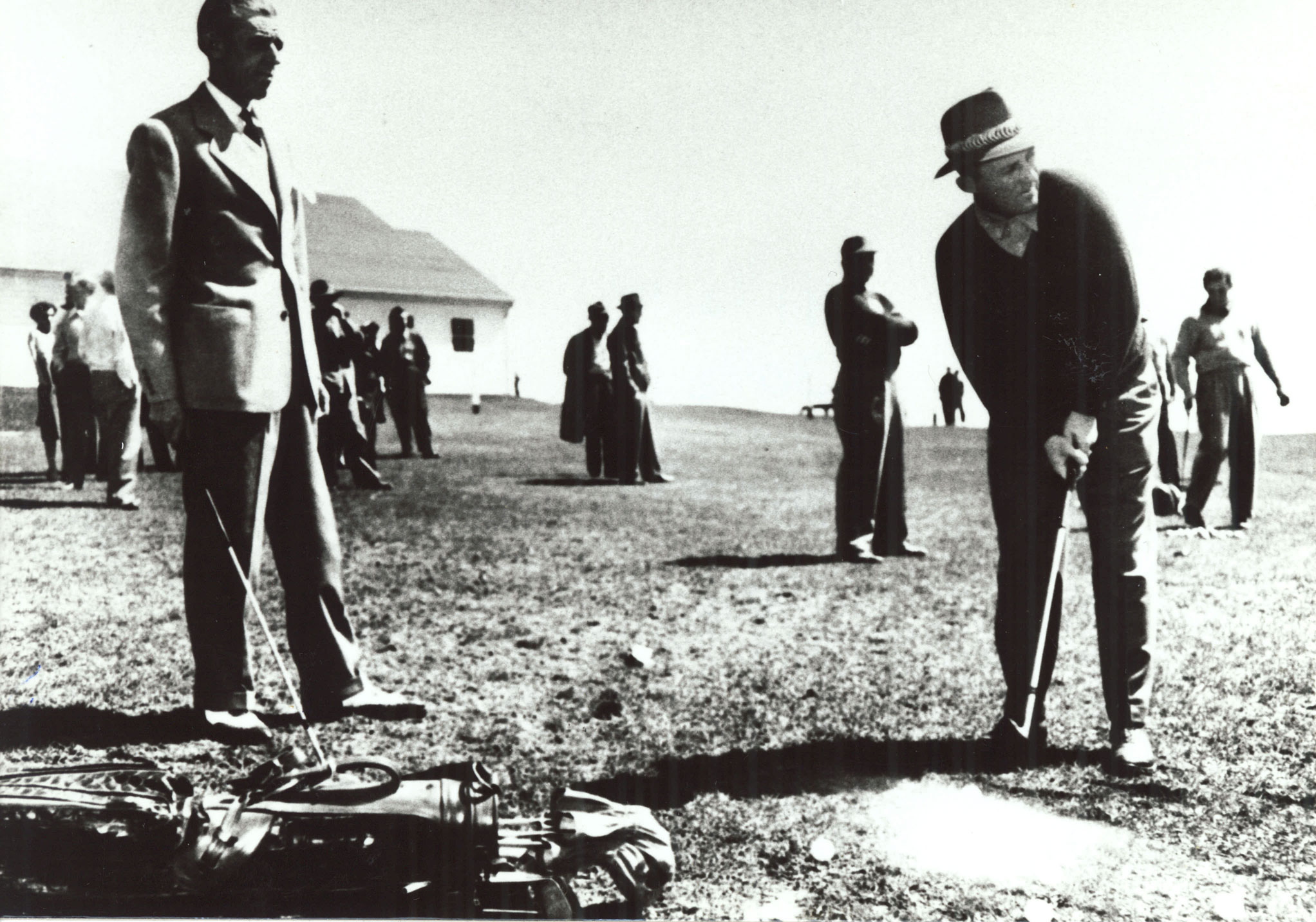 a group of men playing golf