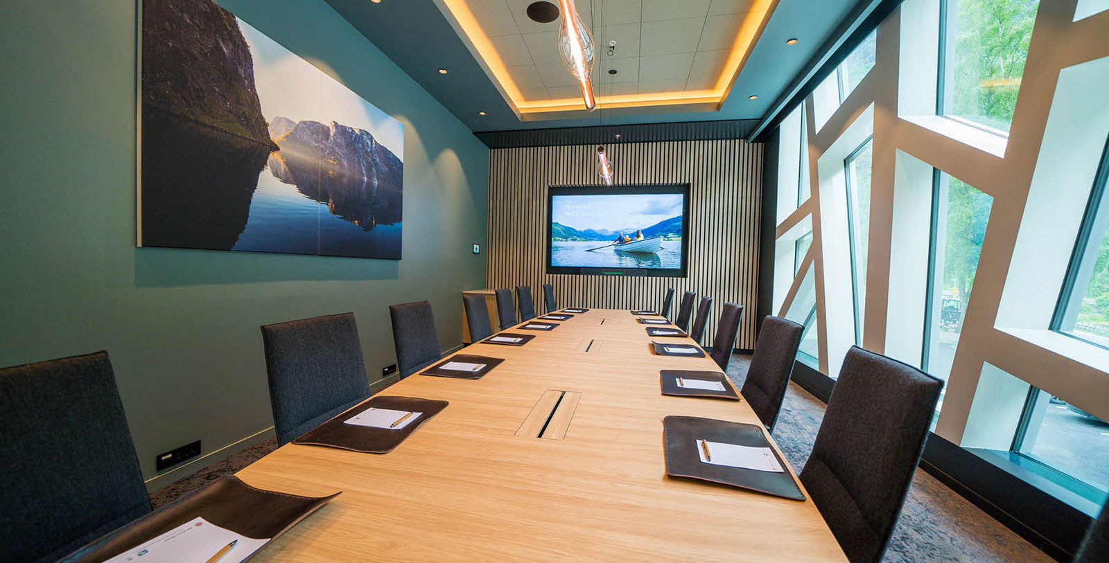 a conference room with a large screen