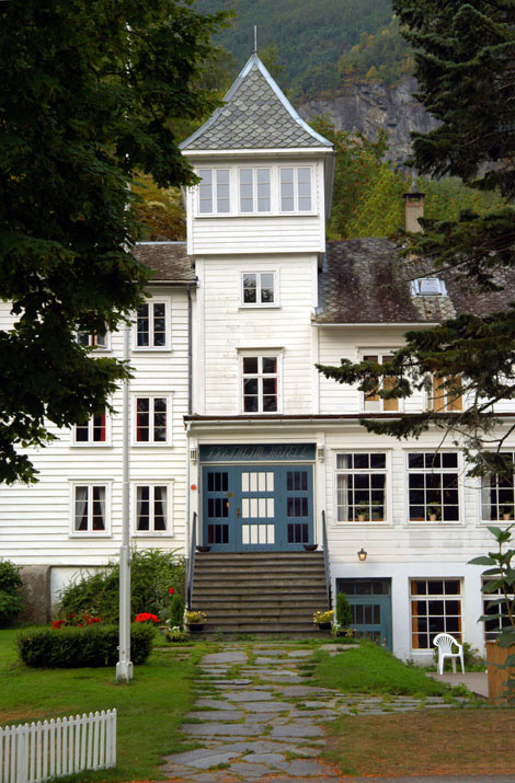 a white house with blue doors