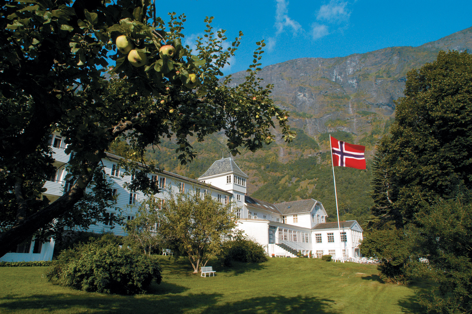 a white building with a flag in front of it