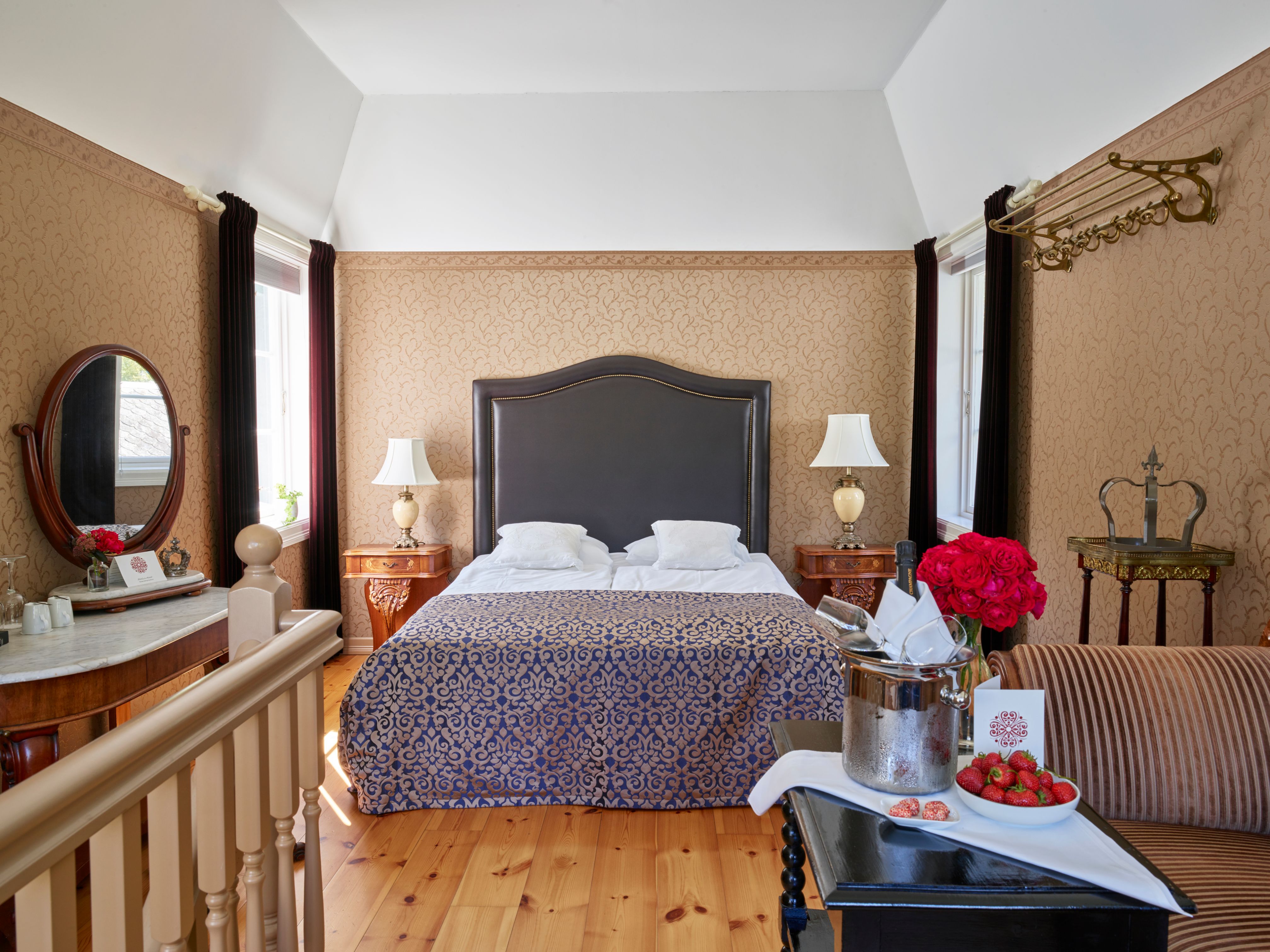 a bedroom with a bed and a mirror