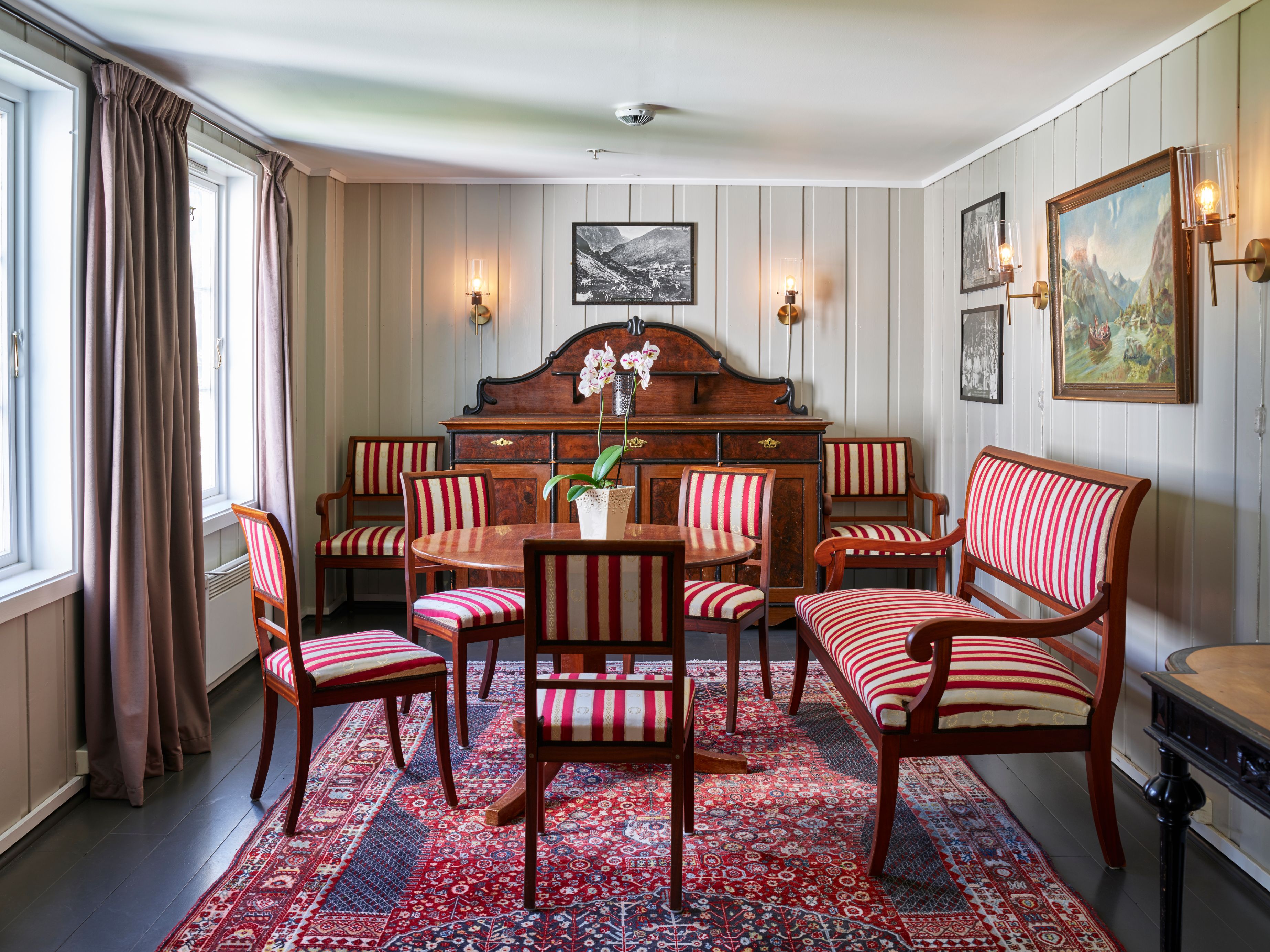 a room with a table and chairs