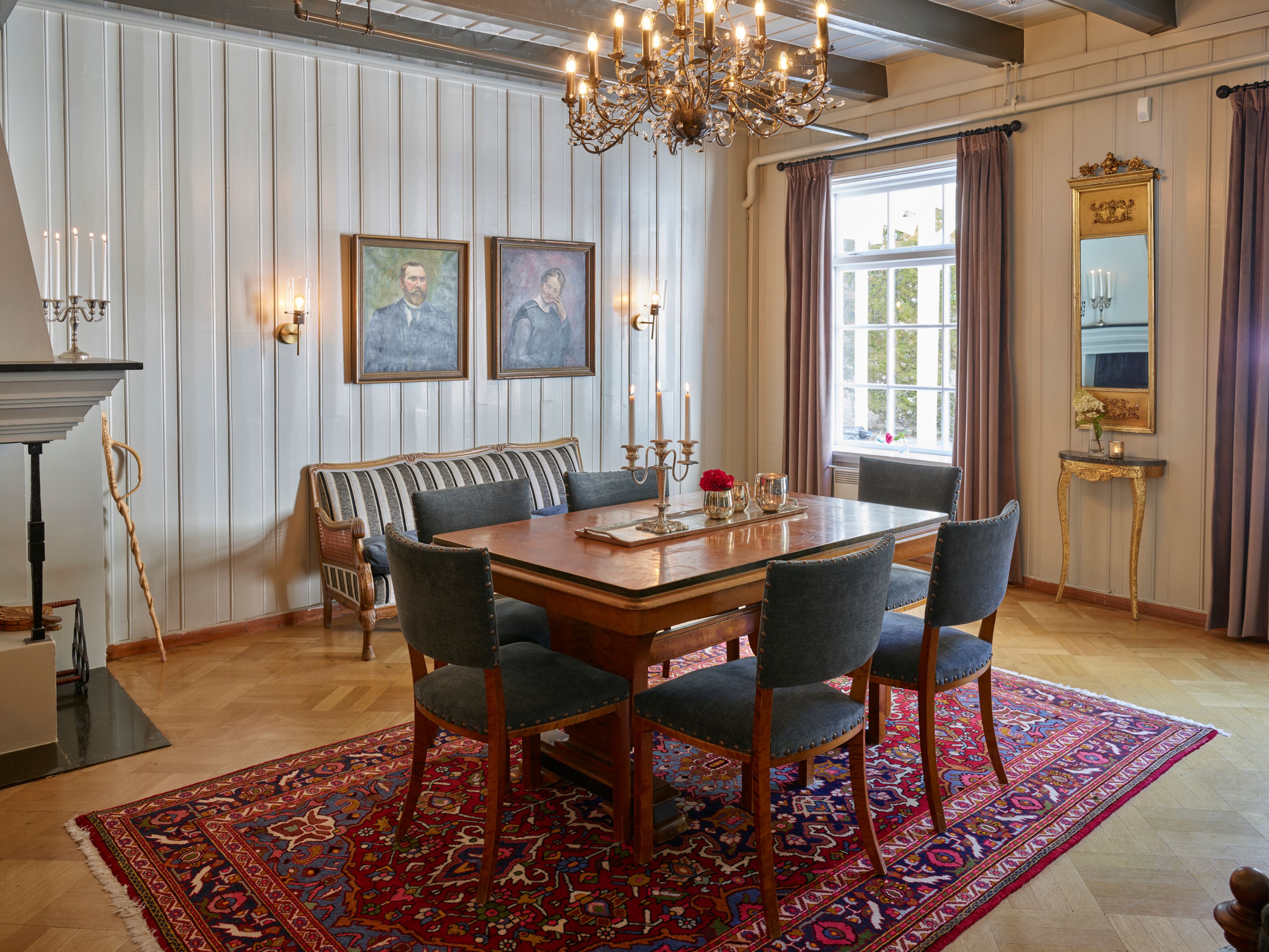 a dining room with a table and chairs