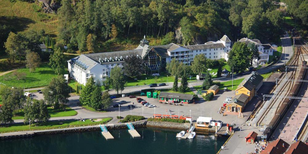 a large building next to a body of water