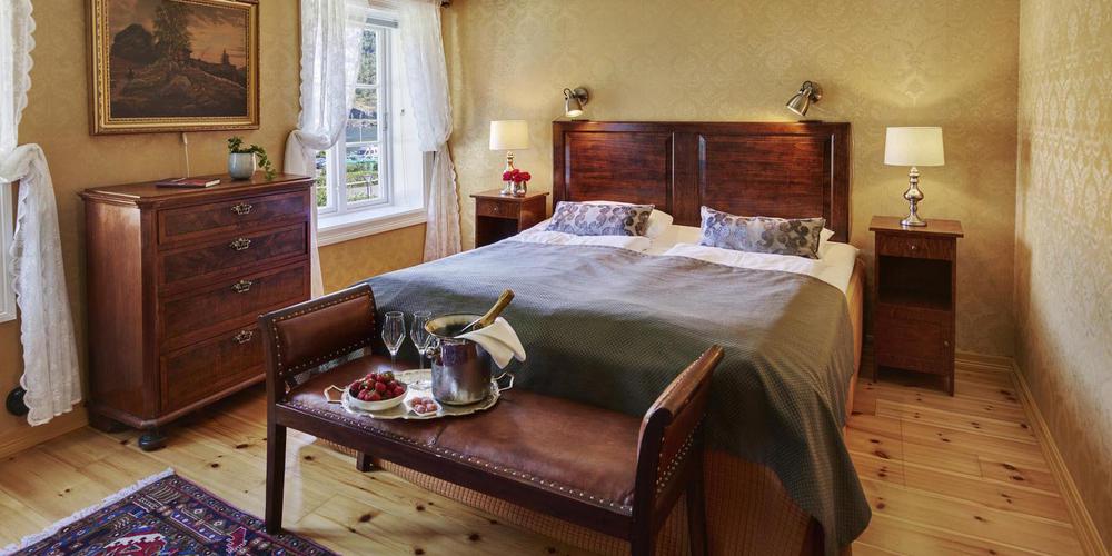 a bed with a tray of food on it