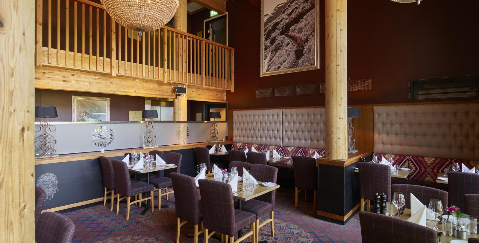 a restaurant with tables and chairs