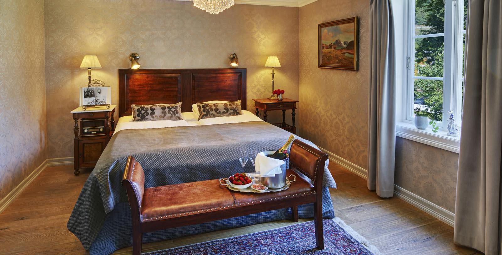a bedroom with a bed and a table