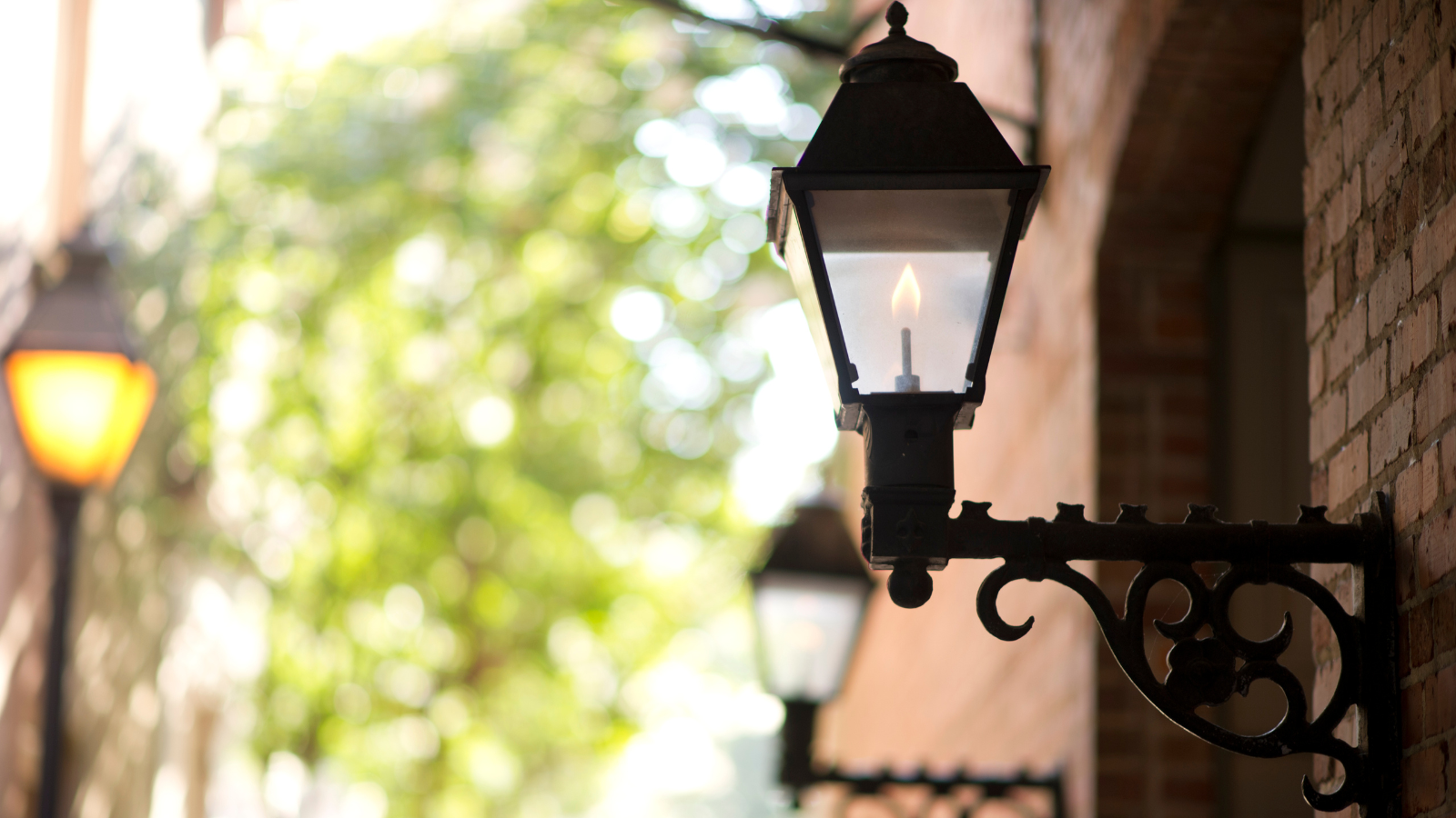 a lamp on a brick wall