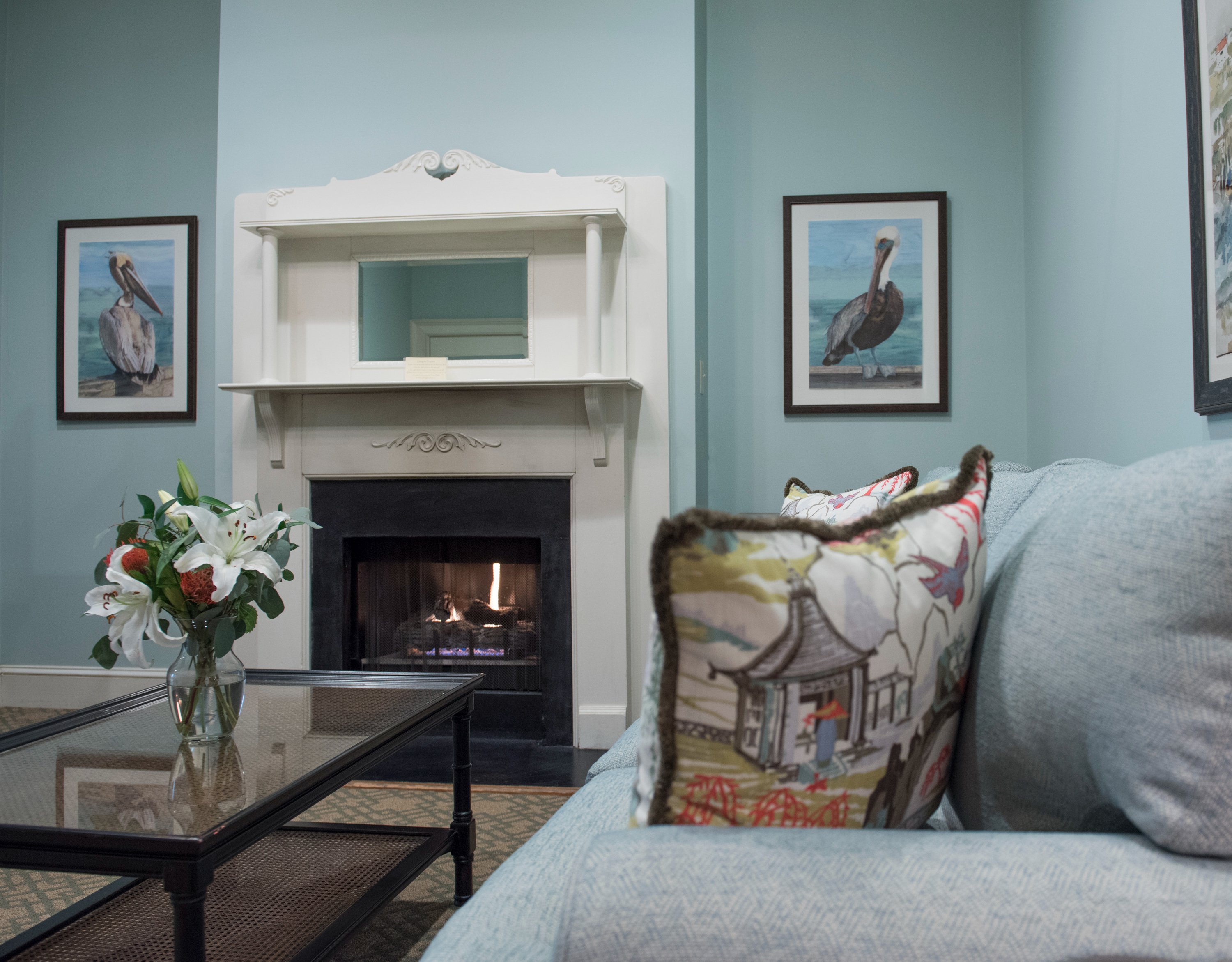 a living room with a fireplace and a couch