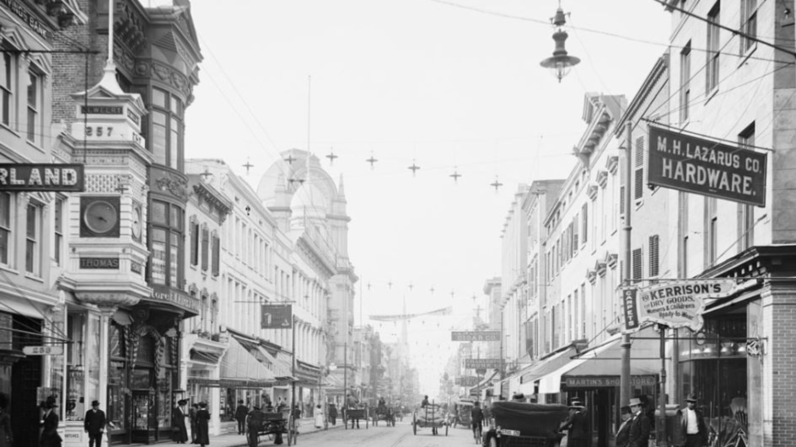 a street with people and cars