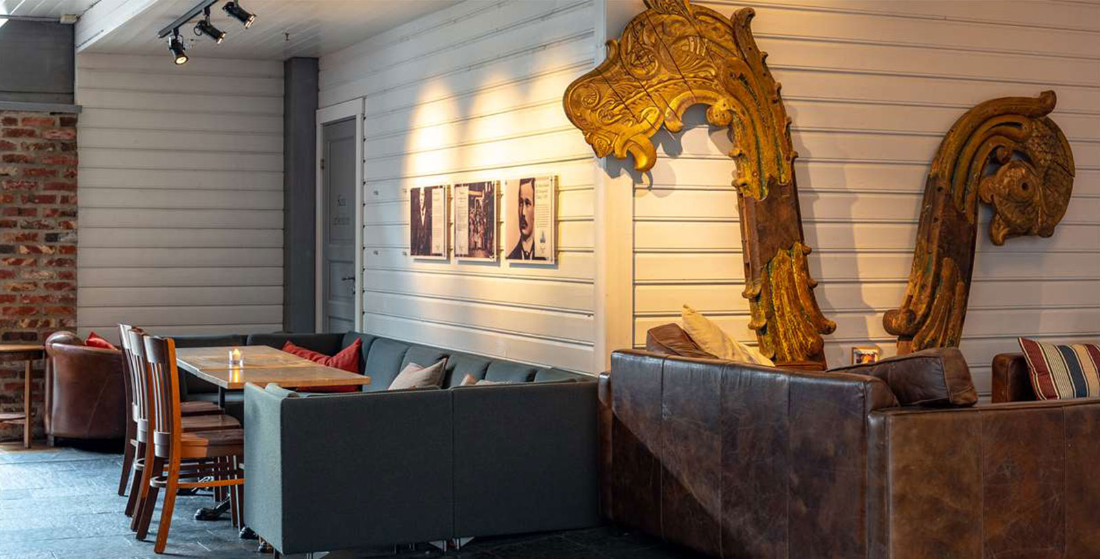 a couch and a table with a gold sculpture on it