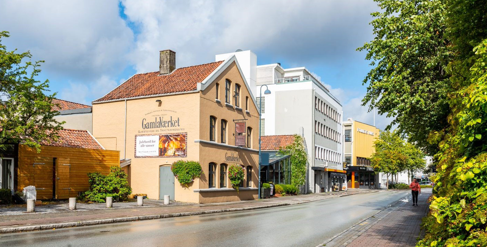a street with buildings and trees