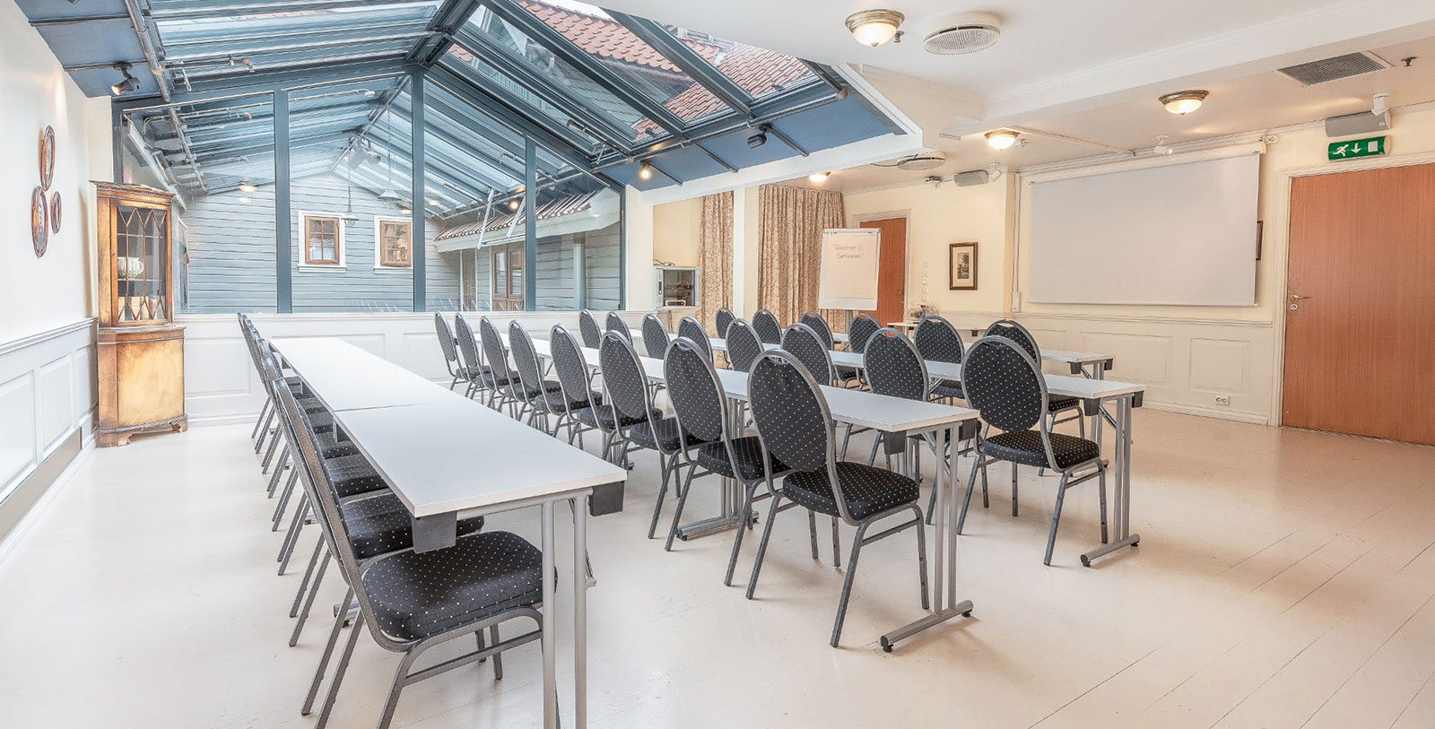 a room with tables and chairs