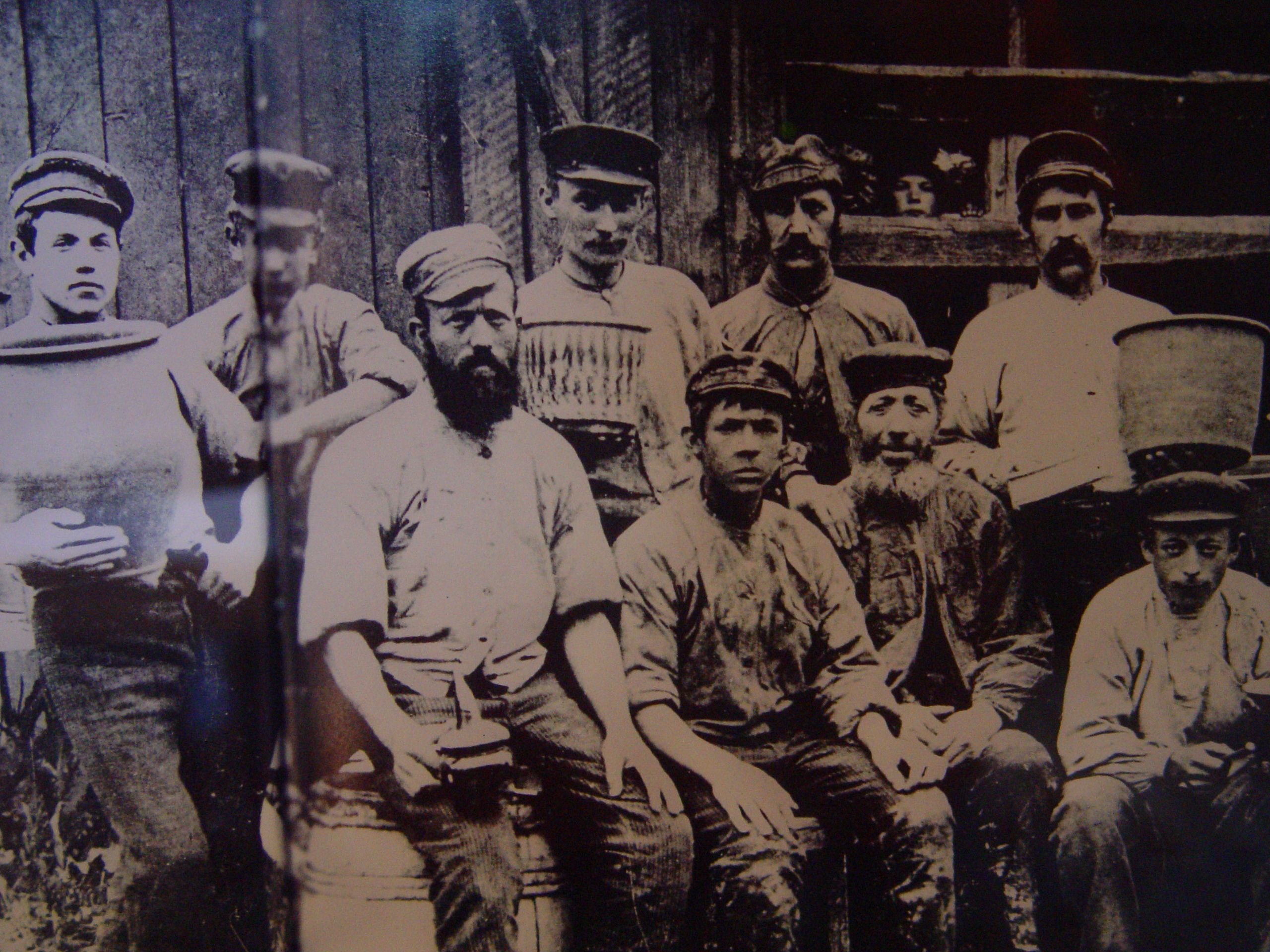 a group of men posing for a photo