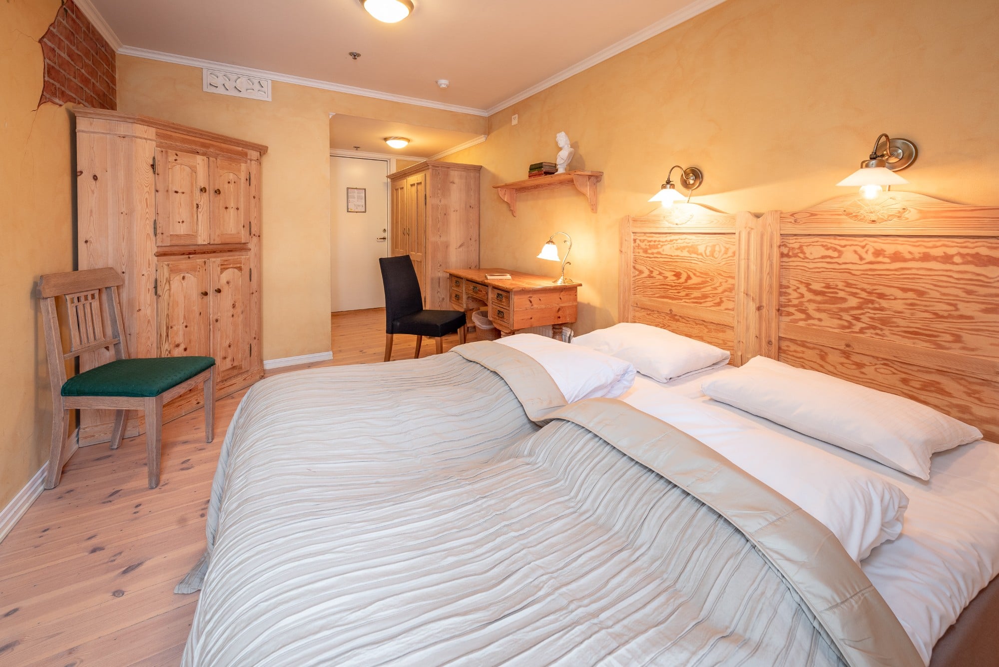 a room with a bed and a desk