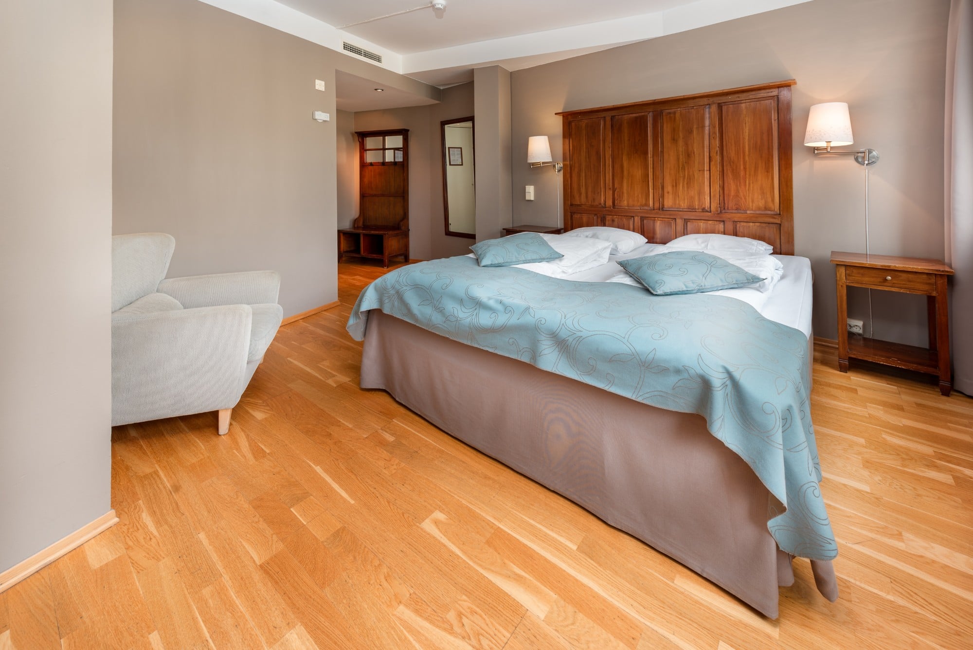 a bedroom with a bed and a couch