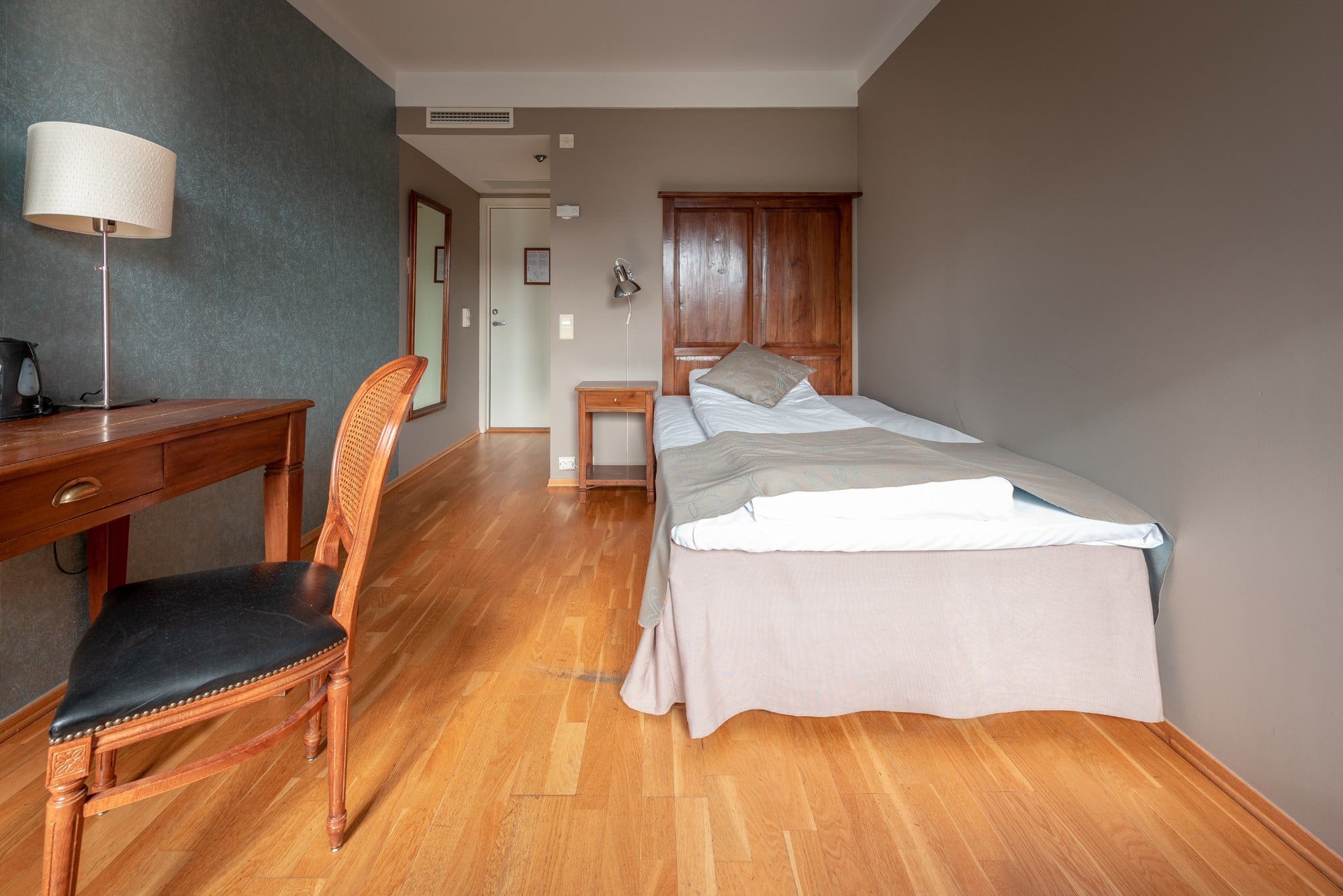 a room with a bed and a chair