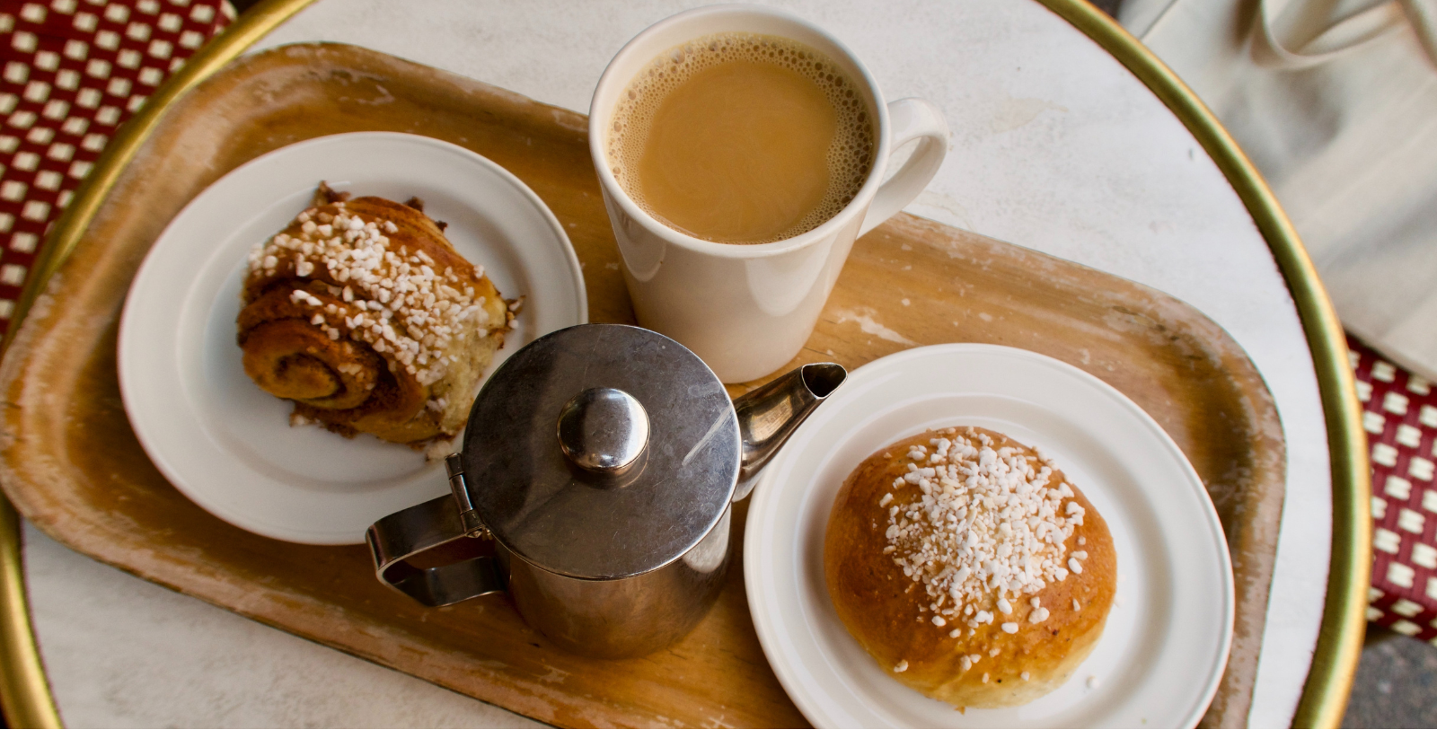 a tray with food and a cup of coffee