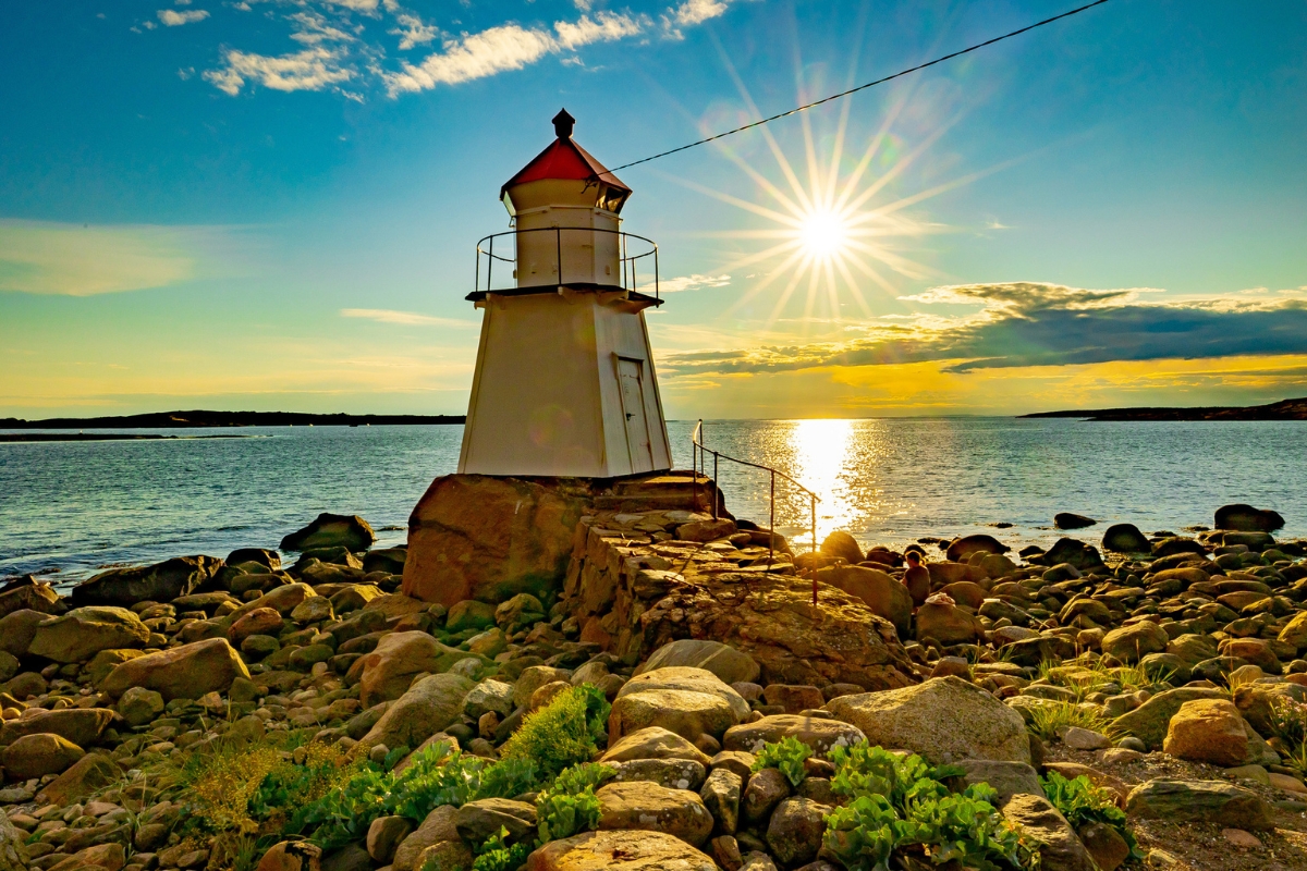 a lighthouse on a rocky beach