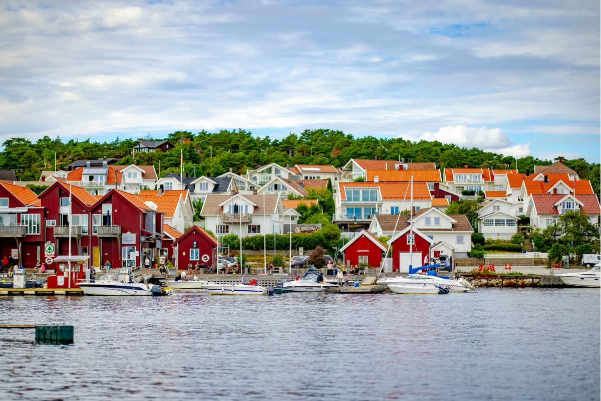 a group of houses on a body of water