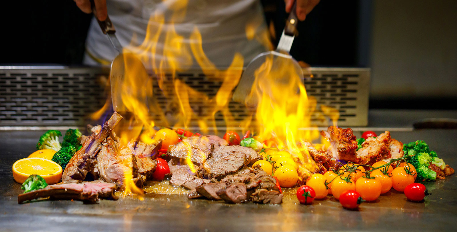 a person cooking food on a grill