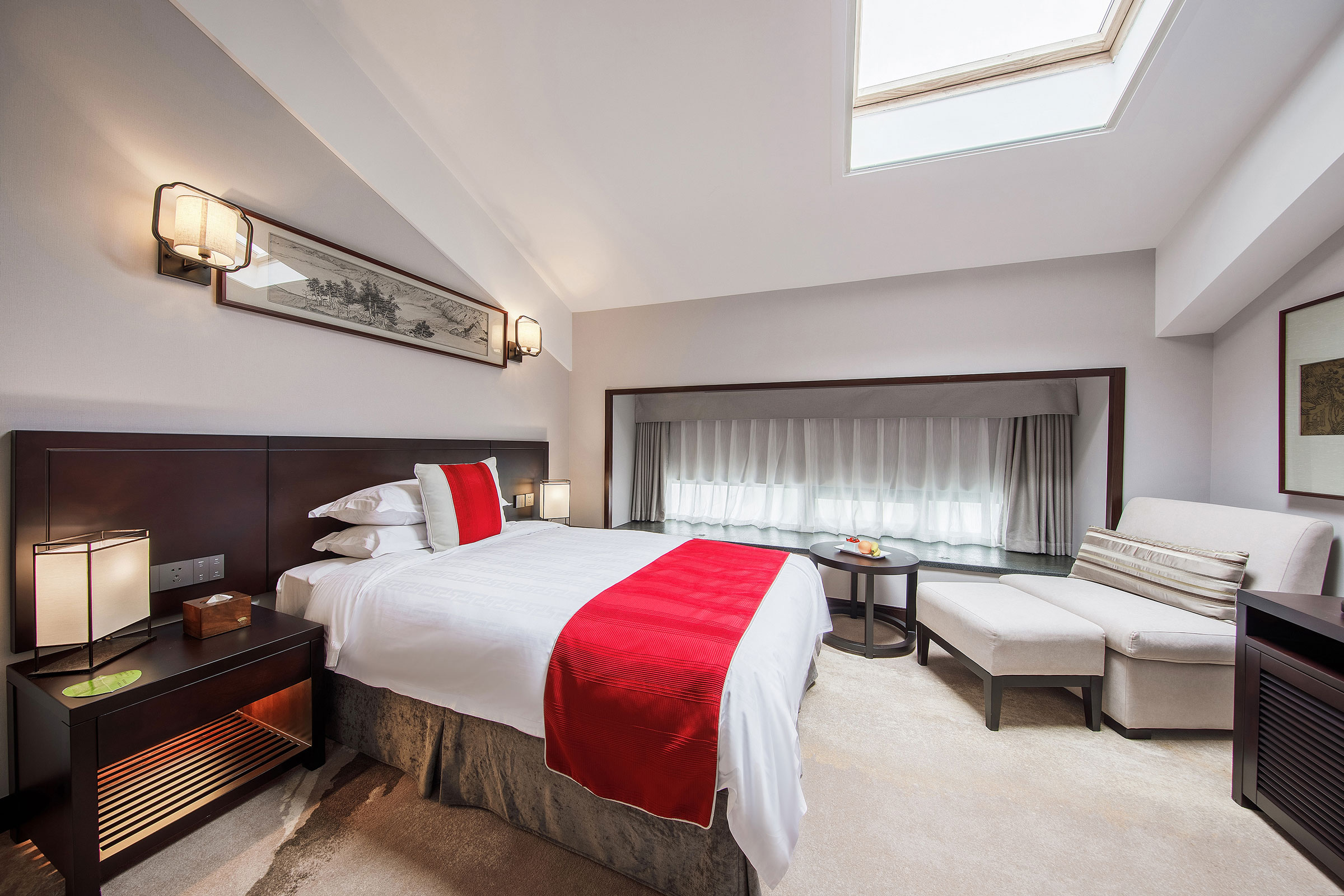 a bedroom with a bed and a table