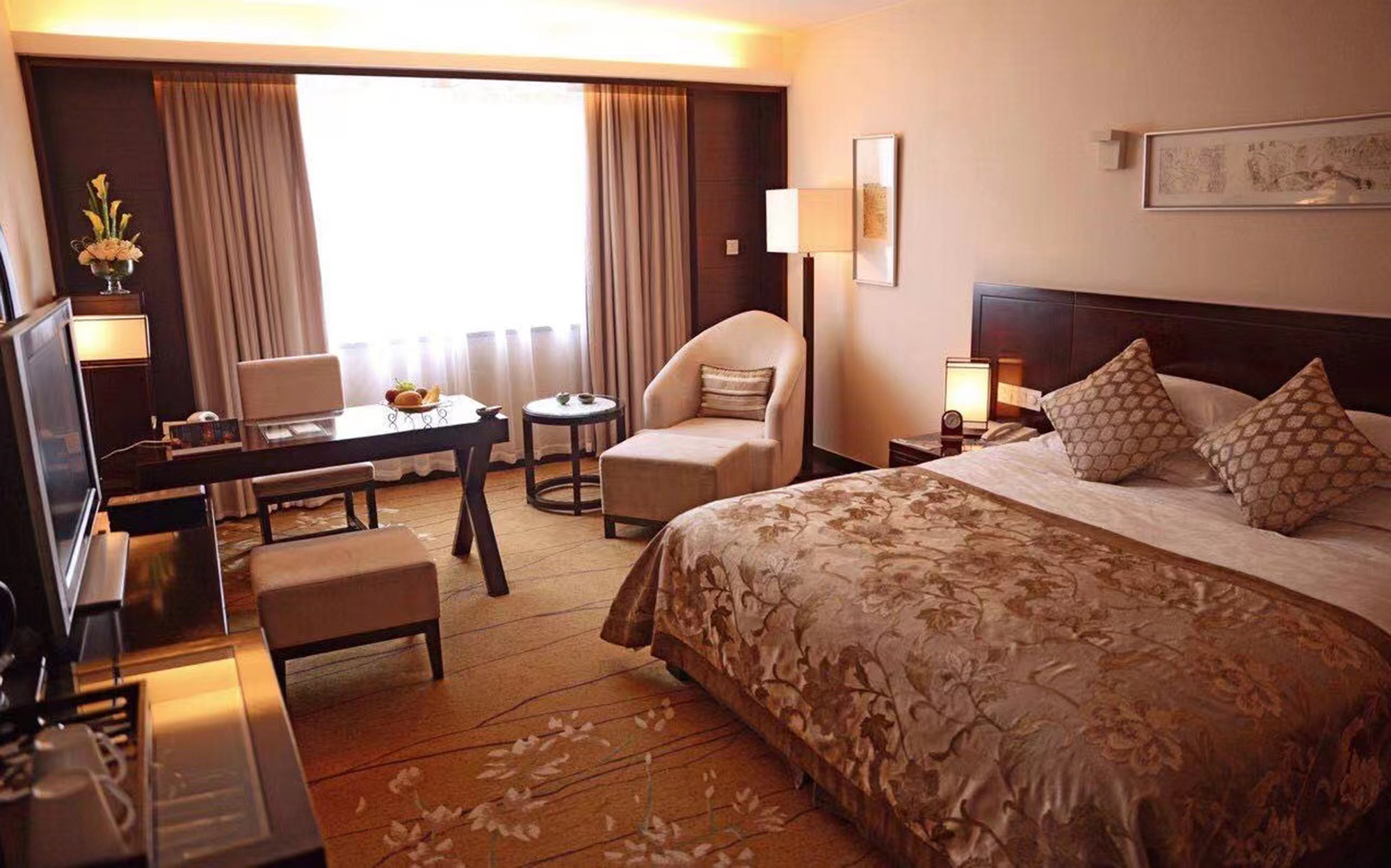 a bedroom with a bed and a table