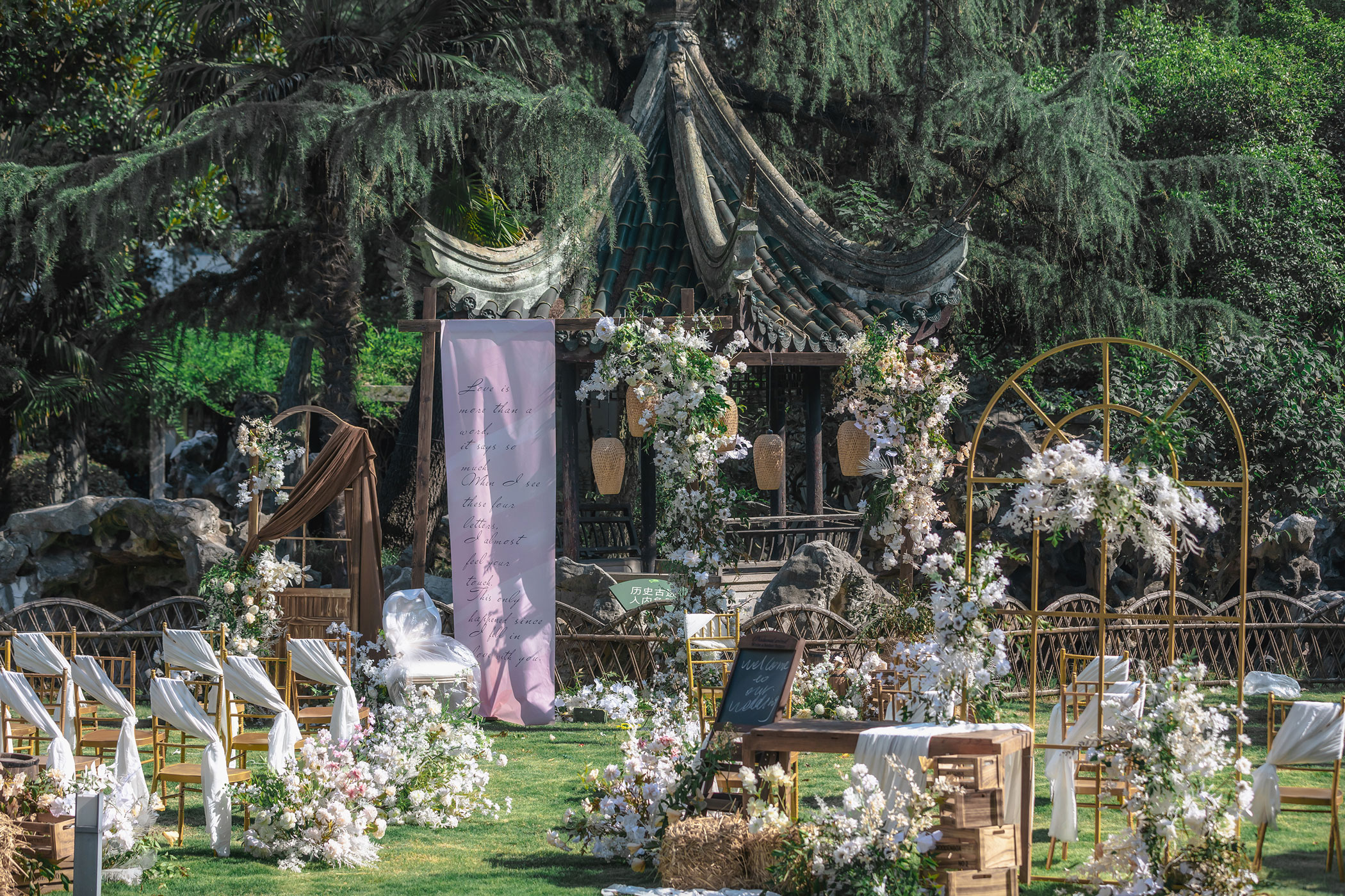 a wedding ceremony with flowers and chairs