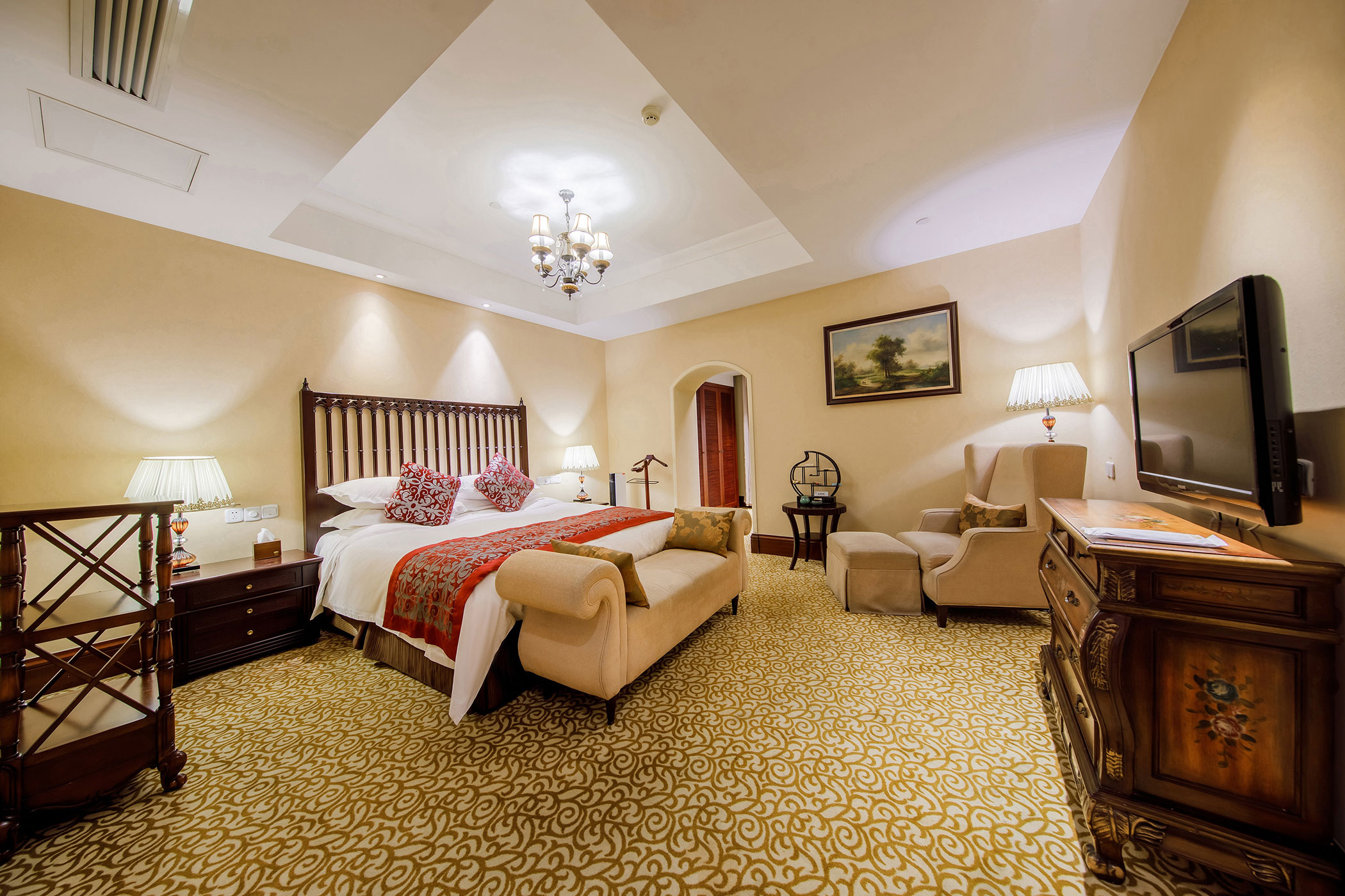 a bedroom with a bed and a dresser