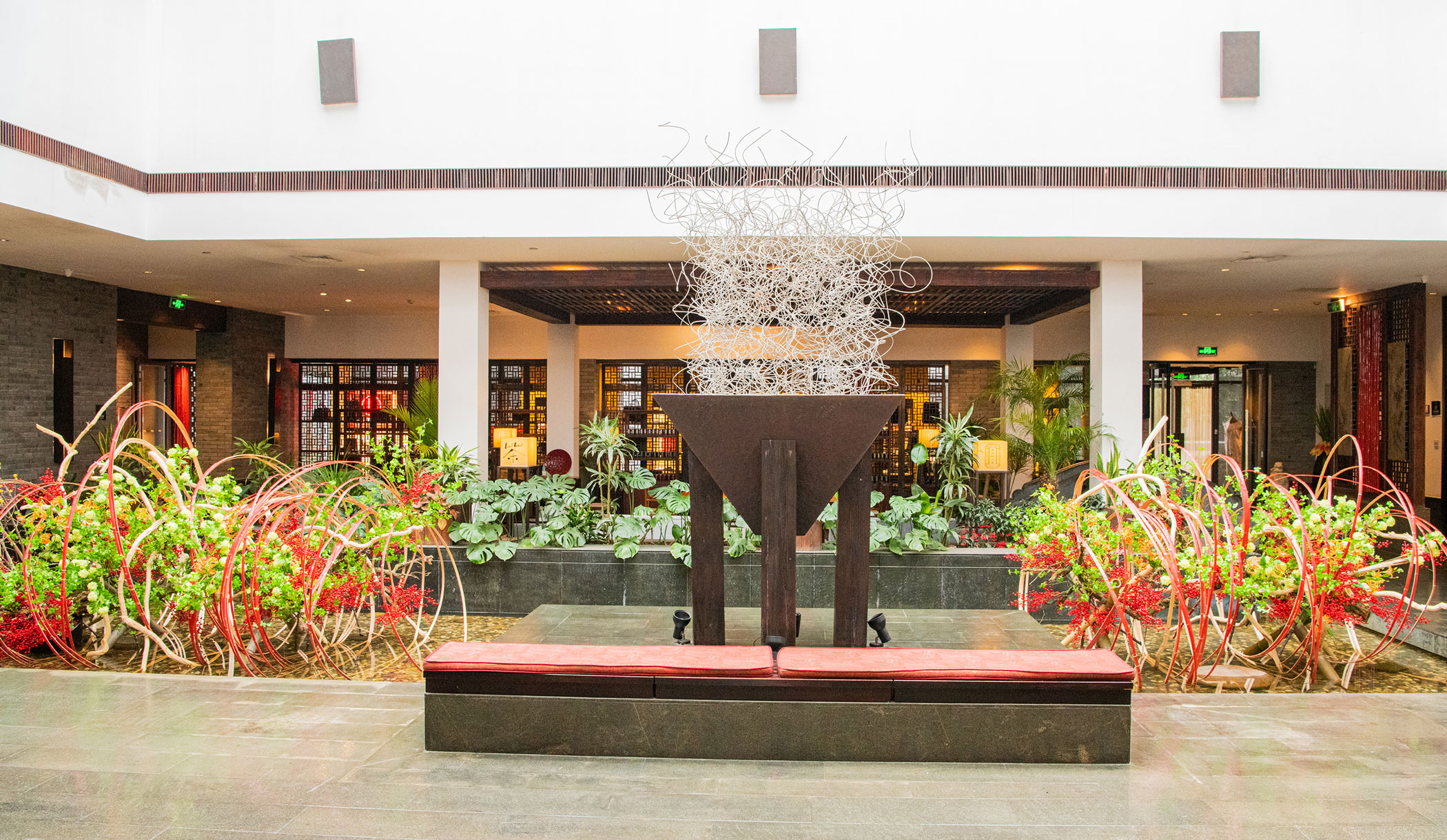 a sculpture in front of a building