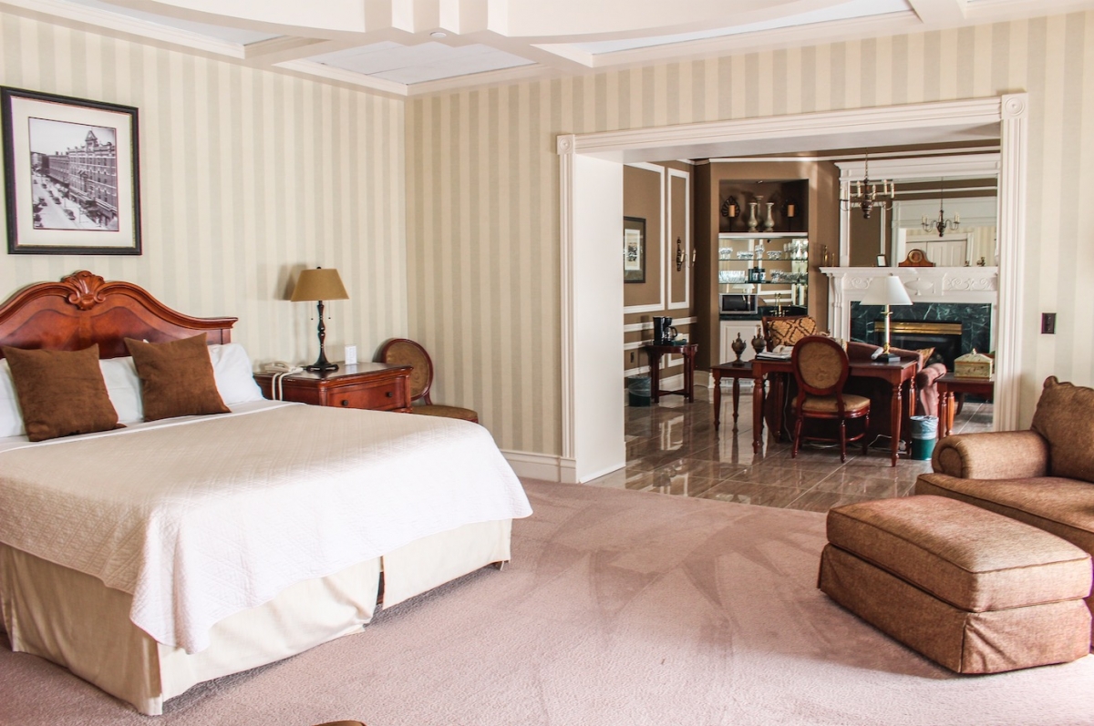 a bedroom with a bed and a table